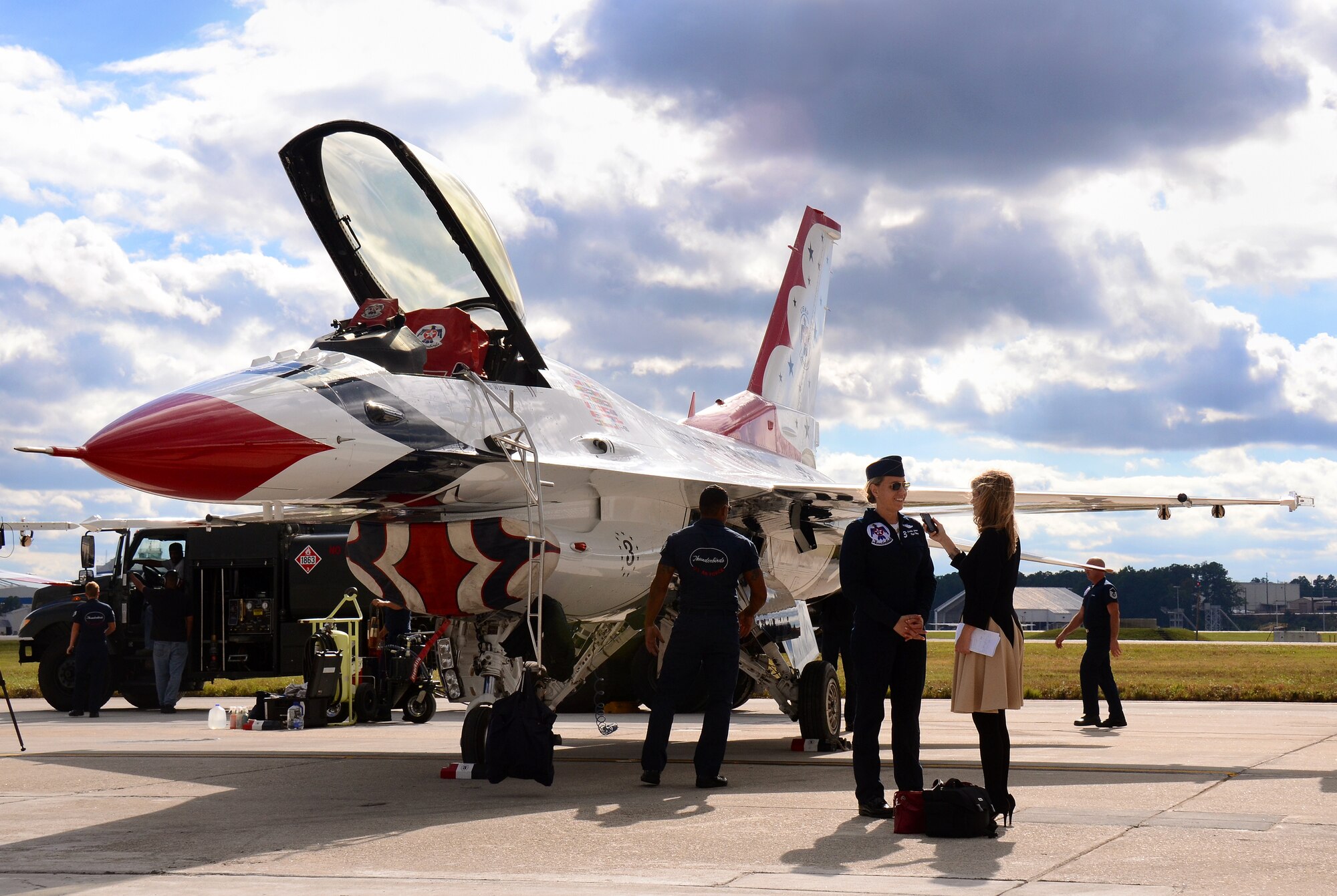 Maj. Caroline Jensen, Thunderbird #3, is interviewed by local media at Dobbins Air Reserve Base, Ga., Oct. 16, 2014. The U.S. Air Force Air Demonstration Squadron Thunderbirds will be performing this weekend at the Russell Regional Airport in Rome, Ga . (U.S. Air Force photo/Brad Fallin/Released)
