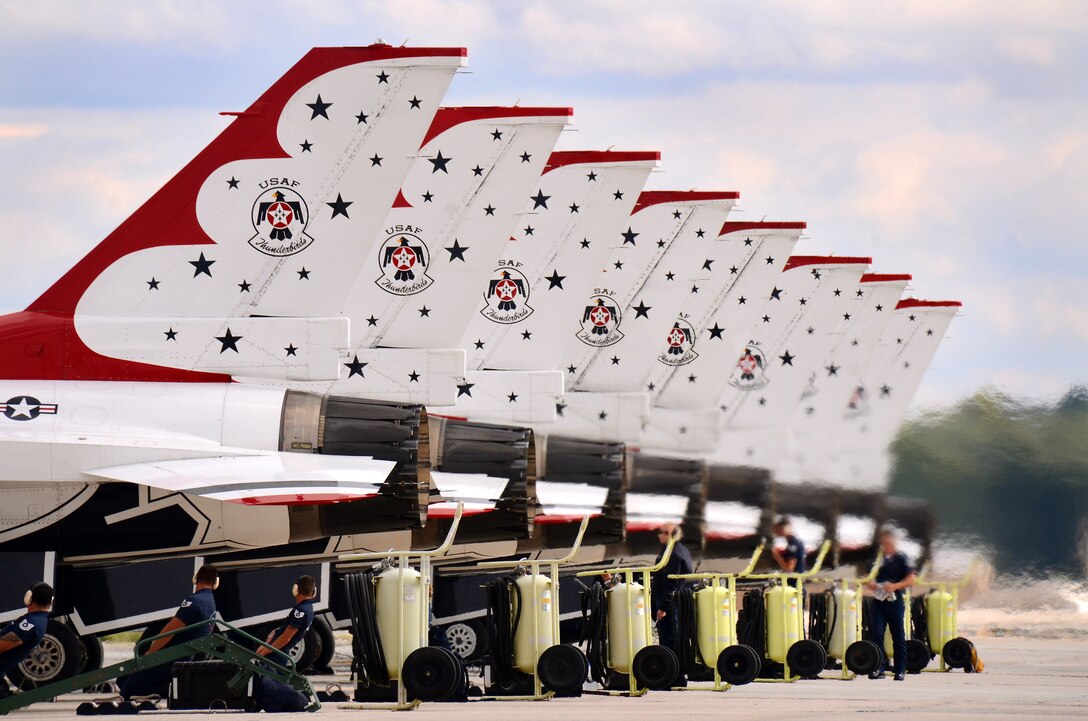 The Thunderbird F-16C Fighting Falcon aircraft are properly aligned before shutting down their engines at Dobbins Air Reserve Base, Ga., Oct. 16, 2014. The U.S. Air Force Air Demonstration Squadron Thunderbirds will be performing this weekend at the Russell Regional Airport in Rome, Ga . (U.S. Air Force photo/Brad Fallin/Released)