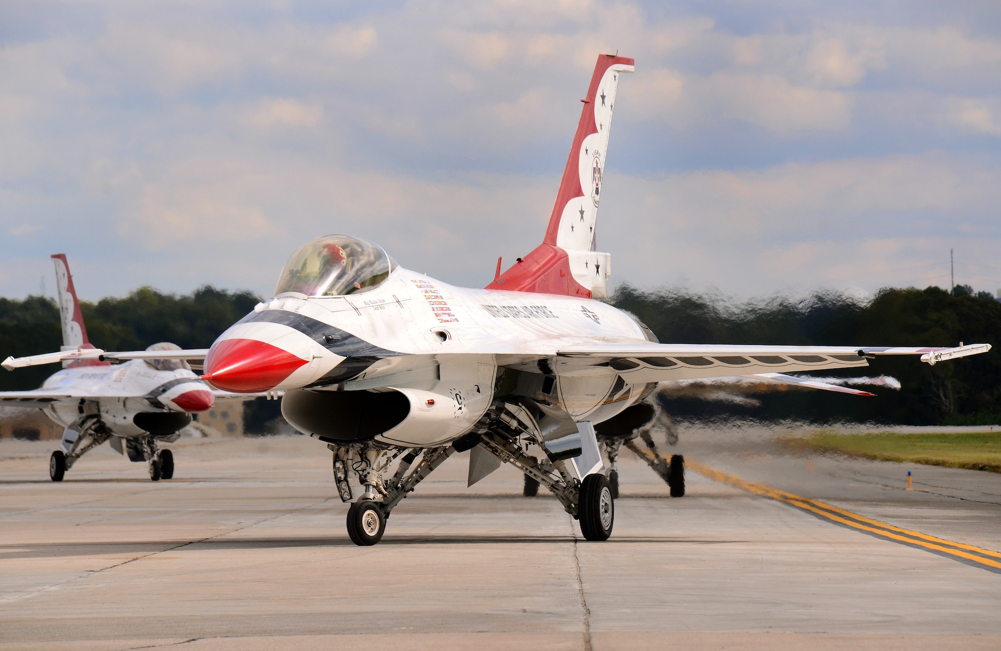 Thunderbird #5 leads teammates upon their arrival at Dobbins Air Reserve Base, Ga., Oct. 16, 2014. The U.S. Air Force Air Demonstration Squadron Thunderbirds will be performing this weekend at the Russell Regional Airport in Rome, Ga . (U.S. Air Force photo/Brad Fallin/Released)