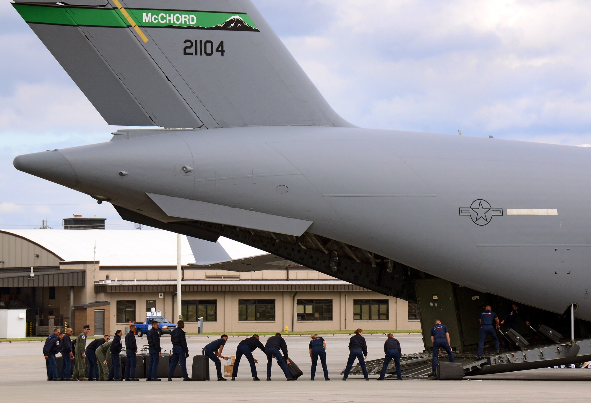 Thunderbird team members unload their cargo from a U.S. Air Force C-17 Globemaster III upon their arrival at Dobbins Air Reserve Base, Ga., Oct. 16, 2014. The aircraft was full of personnel and equipment to support the USAF Air Demonstration Squadron Thunderbirds, who will be performing this weekend at the Russell Regional Airport in Rome, Ga . (U.S. Air Force photo/Brad Fallin/Released)