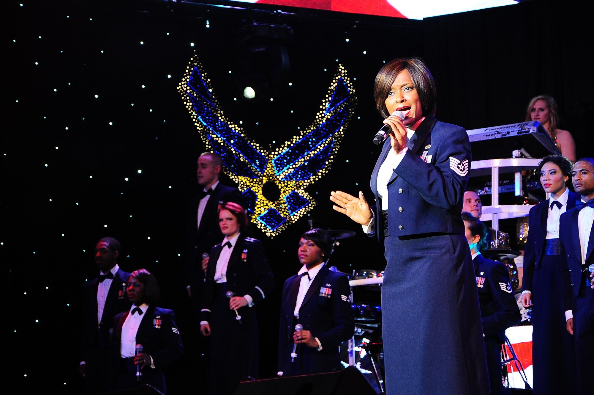 Tech. Sgt. Altrameise Myers, Tops In Blue vocalist, sings a solo during the Tops In Blue performance Oct. 14 at the Mississippi University for Women’s Whitfield Hall. The show finished off with the Tops In Blue cast  singing “God Bless the USA” and “The Air Force Song.” (U.S. Air Force Photo/Airman John Day)