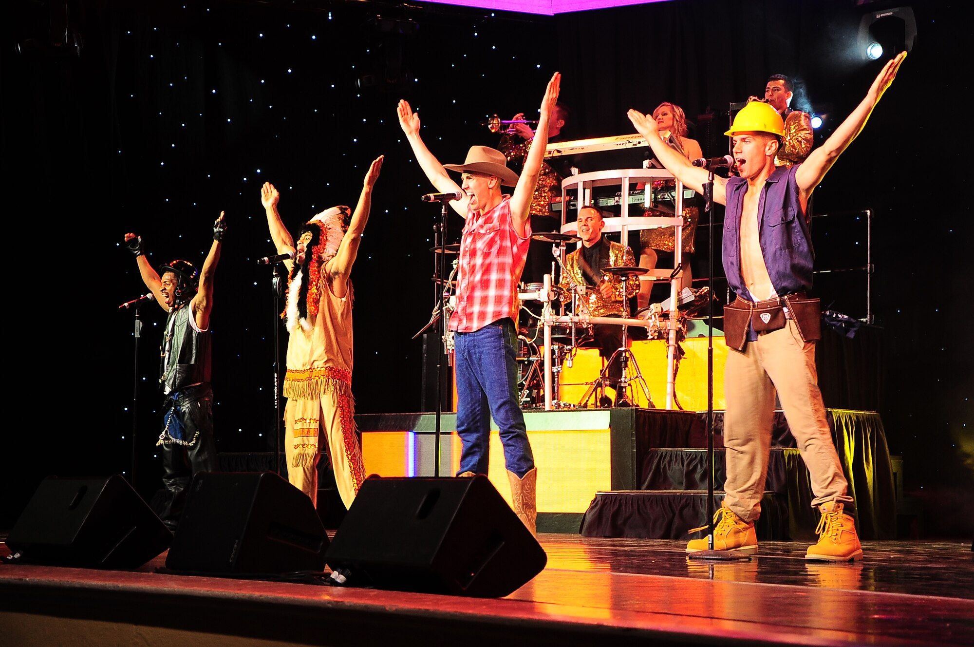 Tops In Blue performers sing and dance along to the popular “YMCA” song at the Tops In Blue performance Oct. 14 at the Mississippi University for Women’s Whitfield Hall. The Tops In Blue performers wear a wide variety of costumes and plenty of sequins throughout their shows. Because they believe that costuming has always been an integral part of pulling a show together, extra effort is made to ensure each member of the team looks their best. (U.S. Air Force Photo/Airman John Day)