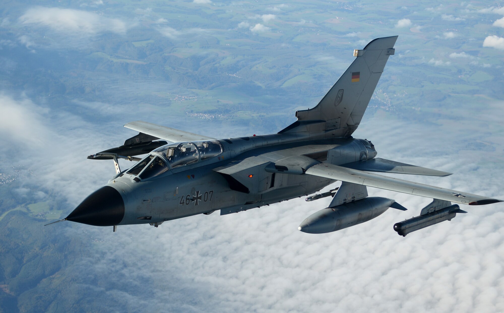 A German Luftwaffe Tornado flies alongside a KC-135 Stratotanker after taking on fuel Oct. 14, 2014, over Germany. Since the beginning of fiscal year 2015, RAF Mildenhall has offloaded fuel to 255 recievers. (U.S. Air Force photo/Airman 1st Class Dillon Johnston/Released)