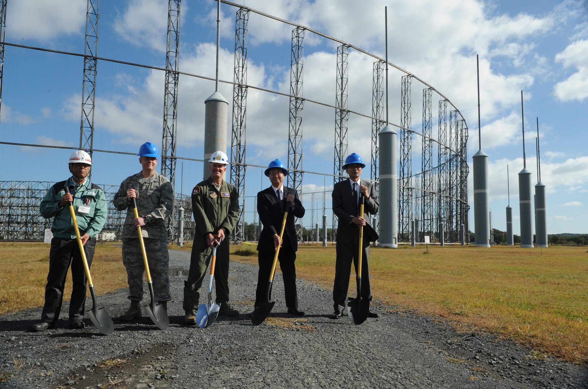 Misawa Air Base leadership and Misawa City officials take part in a ground-breaking ceremony, signifying the start of the demolition of the AN/FLR-9 at Misawa Air Base, Japan, Oct. 15, 2014. The practicality of this structure has become close to obsolete as technology has evolved and fiscal constraints heighten. (U.S. Air Force photo by Airman Jordyn Rucker/Released)