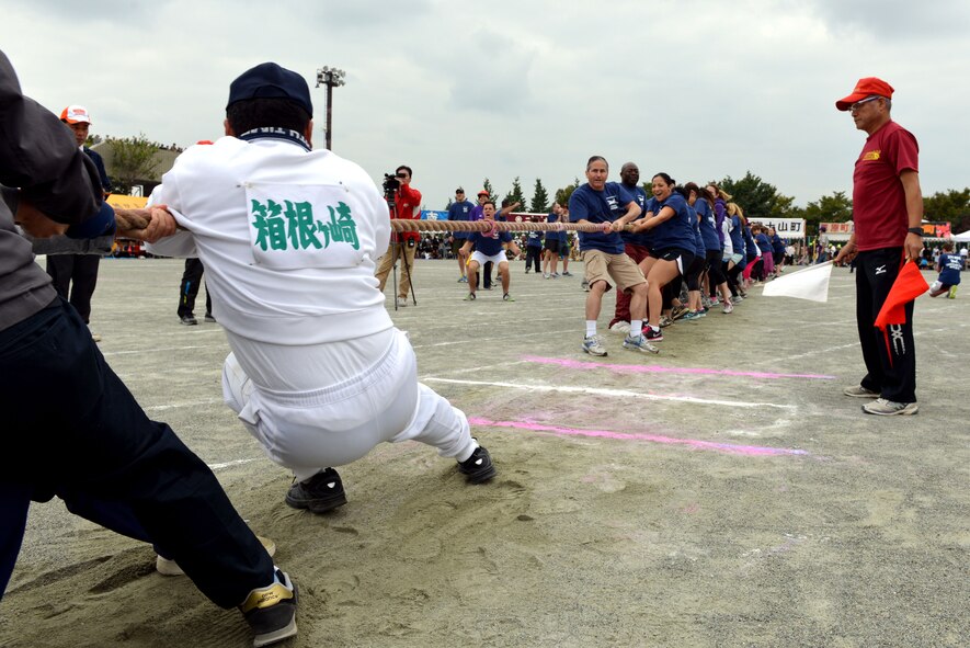 The 374th Maintenance Group participates in a tug-o-war competition during the Mizuho Sports Day Oct. 12, 2014. The 25-man team took first place in Mizuho. (U.S. Air Force photo by Senior Airman Desiree Economides/Released)