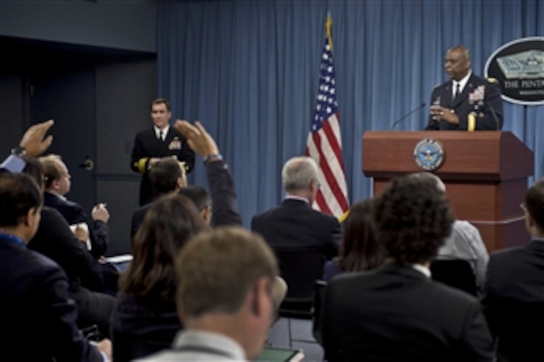 Army Gen. Lloyd J. Austin III, commander of U.S. Central Command, describes the command's role in defeating the Islamic State of Iraq and the Levant, or ISIL, as Pentagon Press Secretary Navy Rear Adm. John Kirby looks on during a press briefing at the Pentagon, Oct. 17, 2014.
