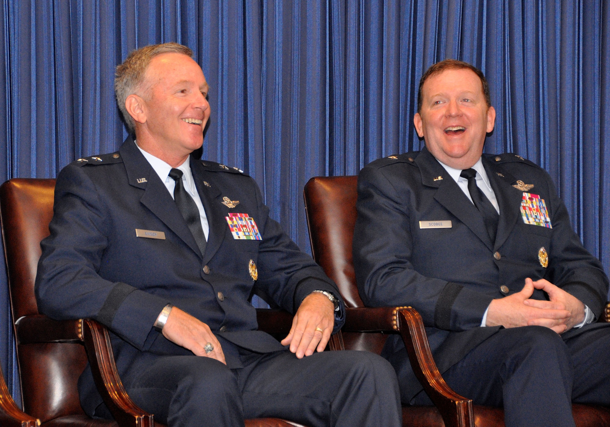 The outgoing and incoming commanders of 10th Air Force, Major General William Binger (left) and Brigadier General Richard Scobee (right) enjoying a light moment during the change of command ceremony at Naval Air Station Fort Worth Joint Reserve Base, Texas on October 18, 2014.