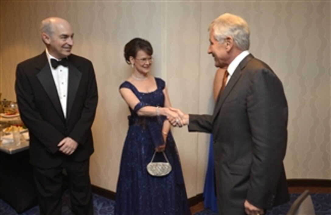Secretary of Defense Chuck Hagel greets 2014 USO Gala attendees before delivering the opening remarks, Washington, D.C. Oct. 17, 2014. 
