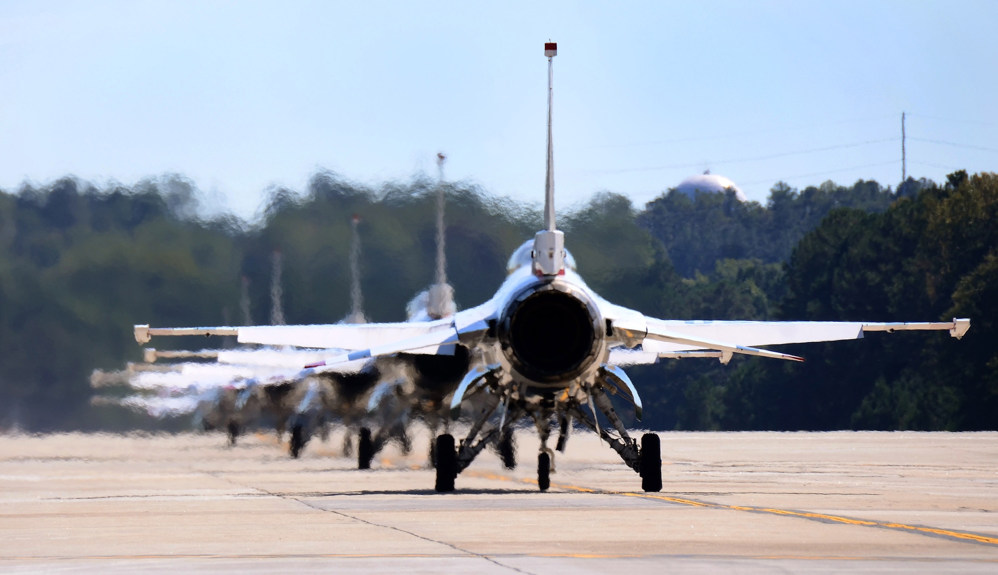 The Thunderbirds six F-16C Fighting Falcons taxi out to the Dobbins Air Reserve Base runway for takeoff to their practice show in Rome, Georgia, Oct., 17. The USAF Air Demonstration Squadron Thunderbirds are using Dobbins as their base of operations for their performances at the Wings Over North Georgia Air Show this weekend at the Russell Regional Airport in Rome, Georgia. (U.S. Air Force photo/ Brad Fallin)
