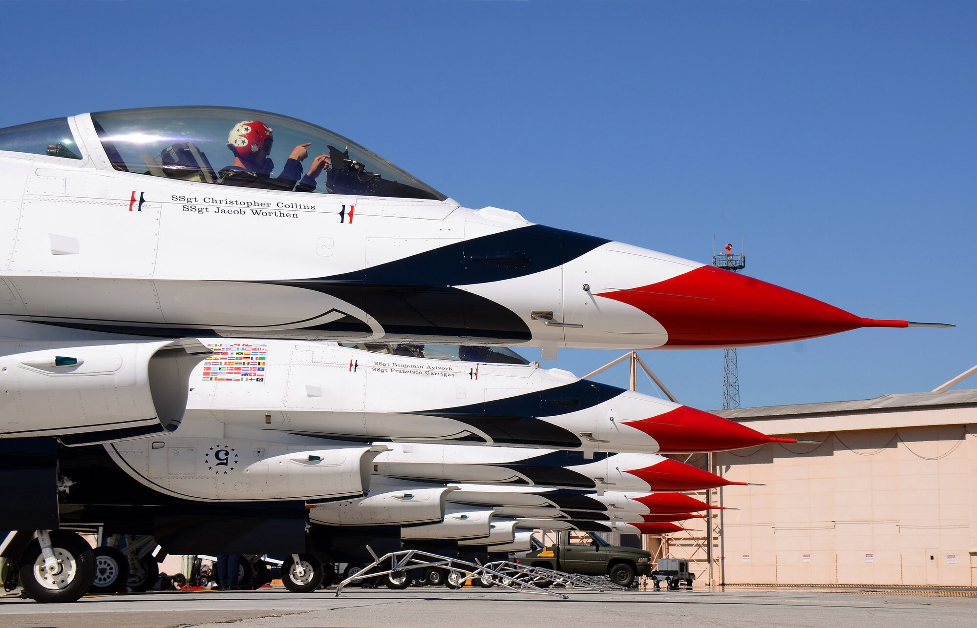 Thunderbirds # 6, opposing solo pilot, Maj. Jason Curtis, makes some final adjustments prior to the Boss leading the team to taxi out from Dobbins Air Reserve Base for their  practice show in Rome, Georgia, Oct., 17. The USAF Air Demonstration Squadron Thunderbirds are using Dobbins as their base of operations for their performances at the Wings Over North Georgia Air Show this weekend at the Russell Regional Airport in Rome, Georgia. (U.S. Air Force photo/ Brad Fallin)