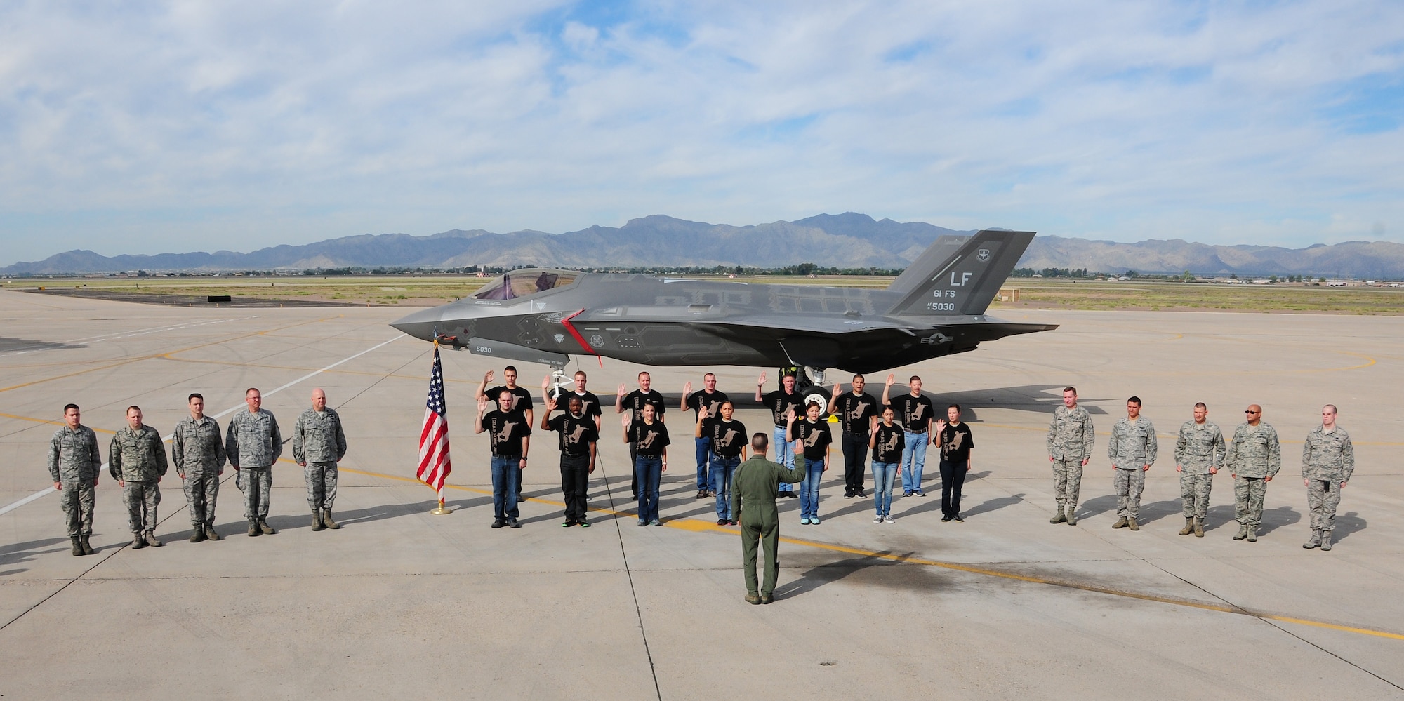 944th Fighter Wings newest recruits stand next to a brand new F-35, raised their hand taking a huge step into their future by enlisting into the Air Force Reserve during a “Total Force” mass enlistment held during the October UTA at Luke Air Force Base, Ariz.. (U.S. Air Force photo taken by Tech. Sgt. Louis Vega Jr.)