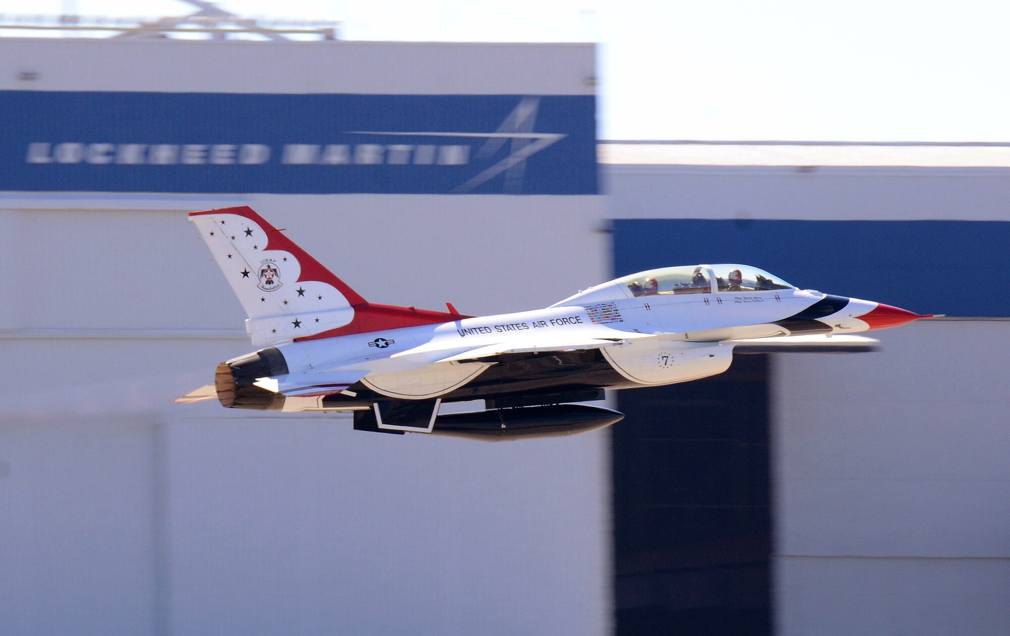 Mrs. Debra Murdock, principal of Cherokee High School in Canton, Georgia, hangs on from the backseat as Maj. Tyler Ellison, Thunderbird #7, the squadron's operation officer, blasts pasts the F-16D manufacturer's logo upon takeoff for her Hometown Hero orientation flight at Dobbins Air Reserve Base, Georgia, Oct., 17. The USAF Air Demonstration Squadron Thunderbirds are using Dobbins as their base of operations for their performances at the Wings Over North Georgia Air Show this weekend at the Russell Regional Airport in Rome, Georgia . (U.S. Air Force photo/ Brad Fallin)