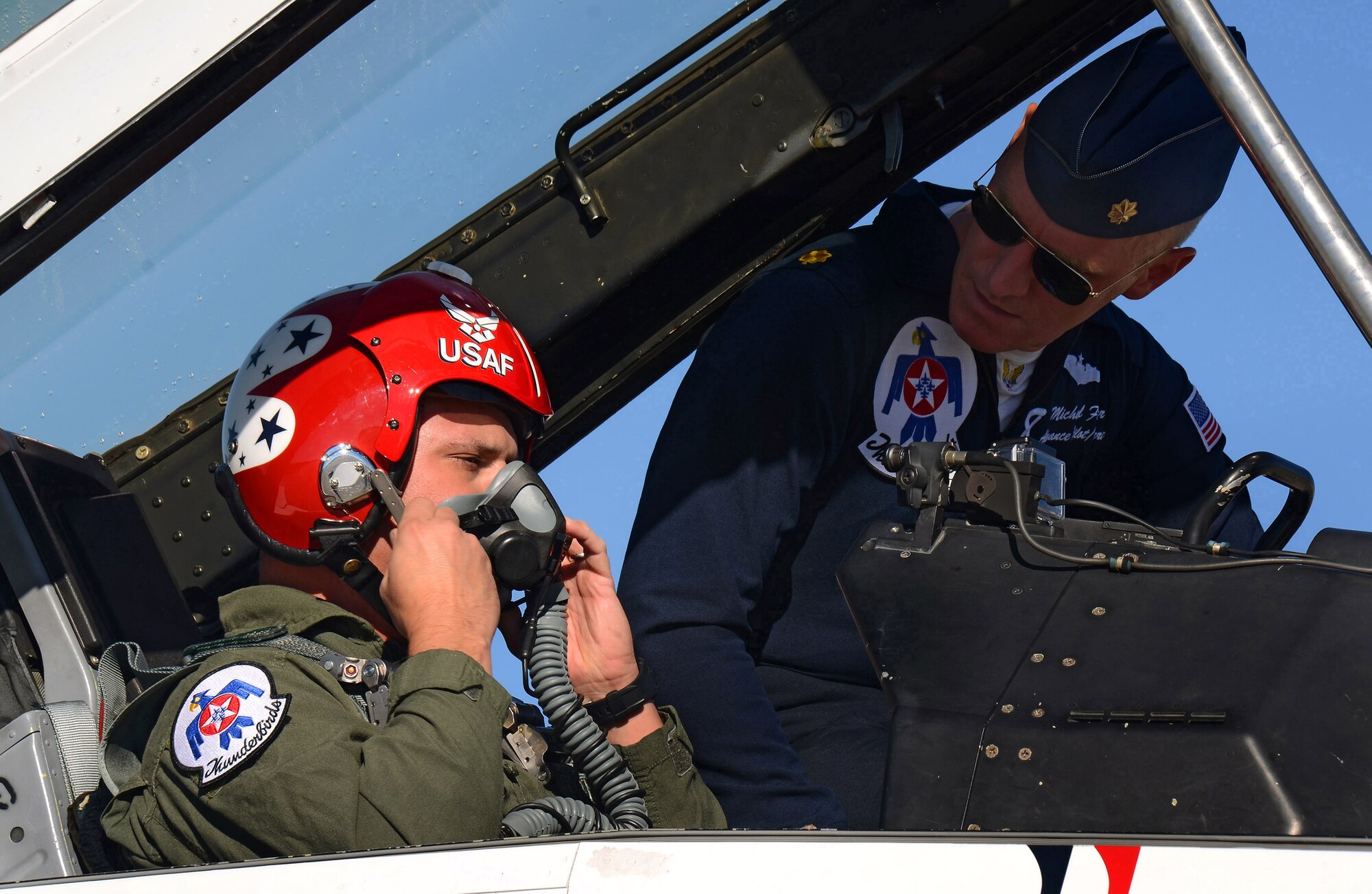 Maj. Michael Fisher, Thunderbirds advance pilot and narrator, ensures Mr. Charles Atkeison, a CNN contributor, is properly connected in the backseat of the F-16D aircraft for his media orientation flight at Dobbins Air Reserve Base, Georgia, Oct., 17. The USAF Air Demonstration Squadron Thunderbirds are using Dobbins as their base of operations for their performances at the Wings Over North Georgia Air Show this weekend at the Russell Regional Airport in Rome, Georgia . (U.S. Air Force photo/ Brad Fallin)