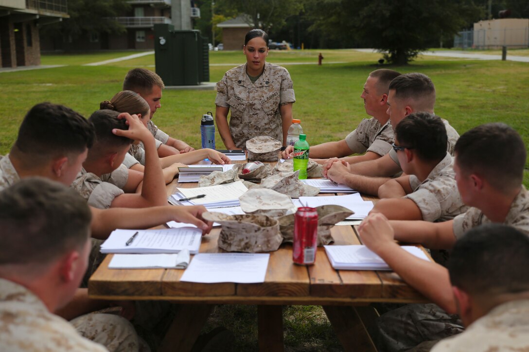Ten lance corporals from 8th Engineer Support Battalion engage in a group discussion with their seminar leader during the first Lance Corporal Leadership and Professional Ethics Seminar Oct. 7, 2014. The seminar focused on developing young lance corporals into stronger, more confident, independent and ethical leaders. The five-day seminar may become a requirement for promotion to non-commissioned officer. (Marine Corps photo by Lance Cpl. Michelle M. Reif/ Released)