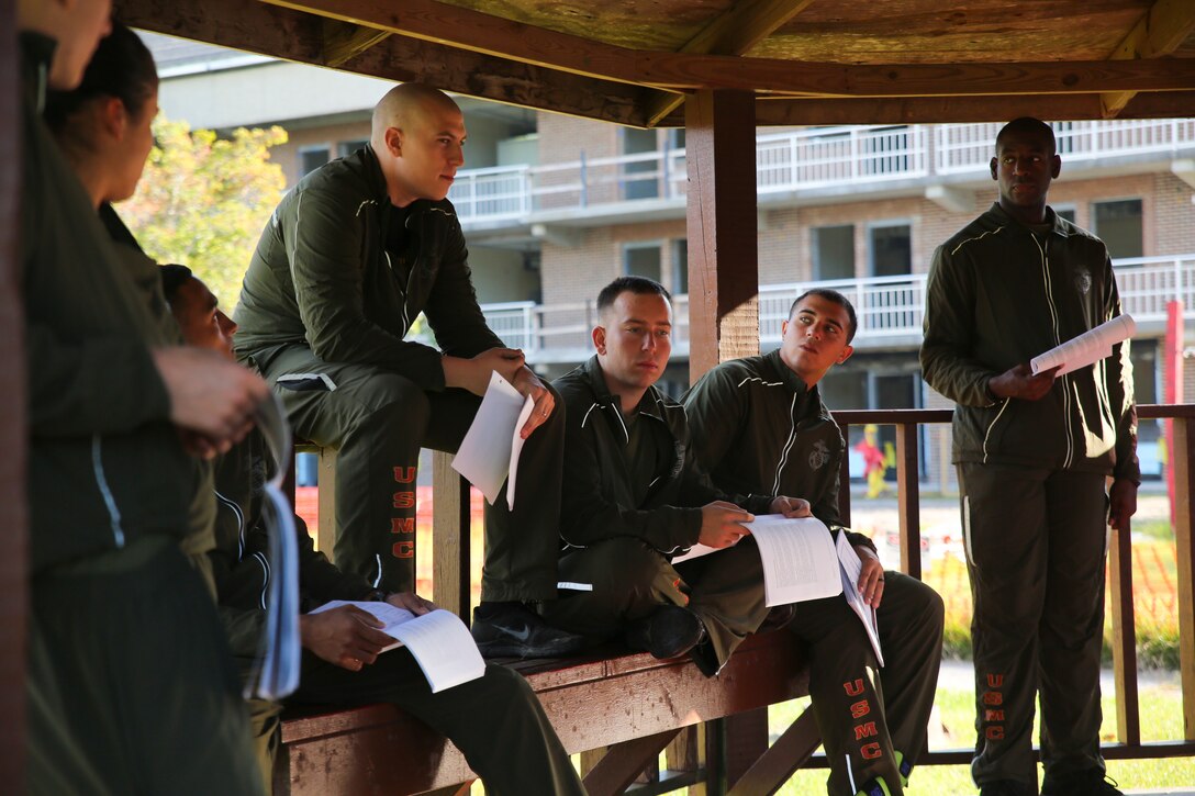 Ten lance corporals from 8th Engineer Support Battalion engage in a group discussion with their seminar leader during the first Lance Corporal Leadership and Professional Ethics Seminar Oct. 10, 2014. The seminar focused on developing young lance corporals into stronger, more confident, independent and ethical leaders. The five-day seminar may become a requirement for promotion to non-commissioned officer. (Marine Corps photo by Lance Cpl. Michelle M. Reif/ Released)