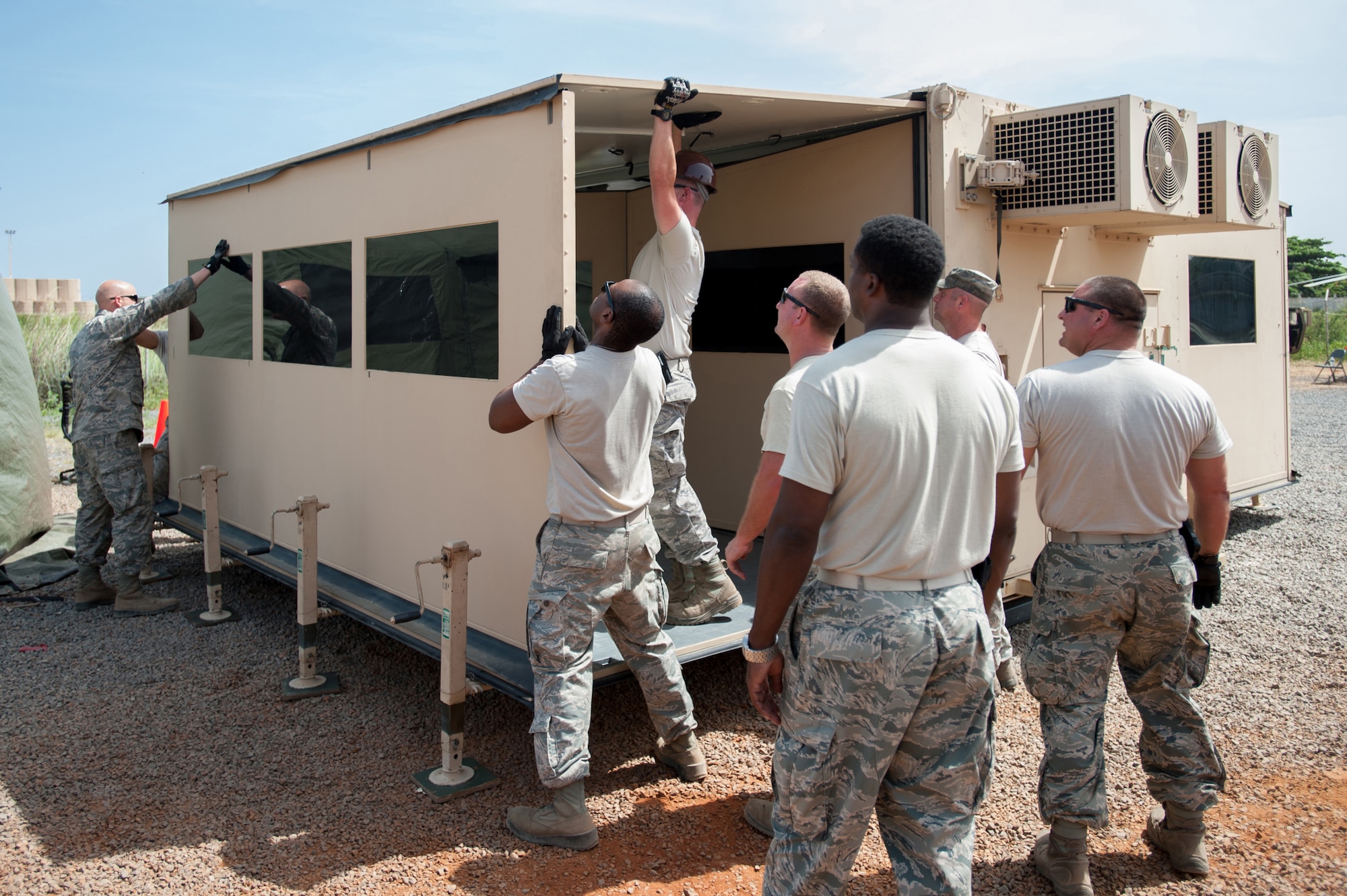 Airmen from the Kentucky Air National Guard’s 123rd Contingency Response Group set up a mobile airfield operations center Oct. 17, 2014, at Léopold Sédar Senghor International Airport in Dakar, Senegal. The operations are in support of Operation United Assistance, the U.S. Agency for International Development-led, whole-of-government effort to respond to the Ebola outbreak in West Africa. The Airmen are operating an intermediate staging base in Dakar to funnel humanitarian aid into affected areas, working in concert with Soldiers from the U.S. Army’s 689th Rapid Port Opening Element to staff a Joint Task Force-Port Opening. (U.S. Air National Guard photo/Maj. Dale Greer)