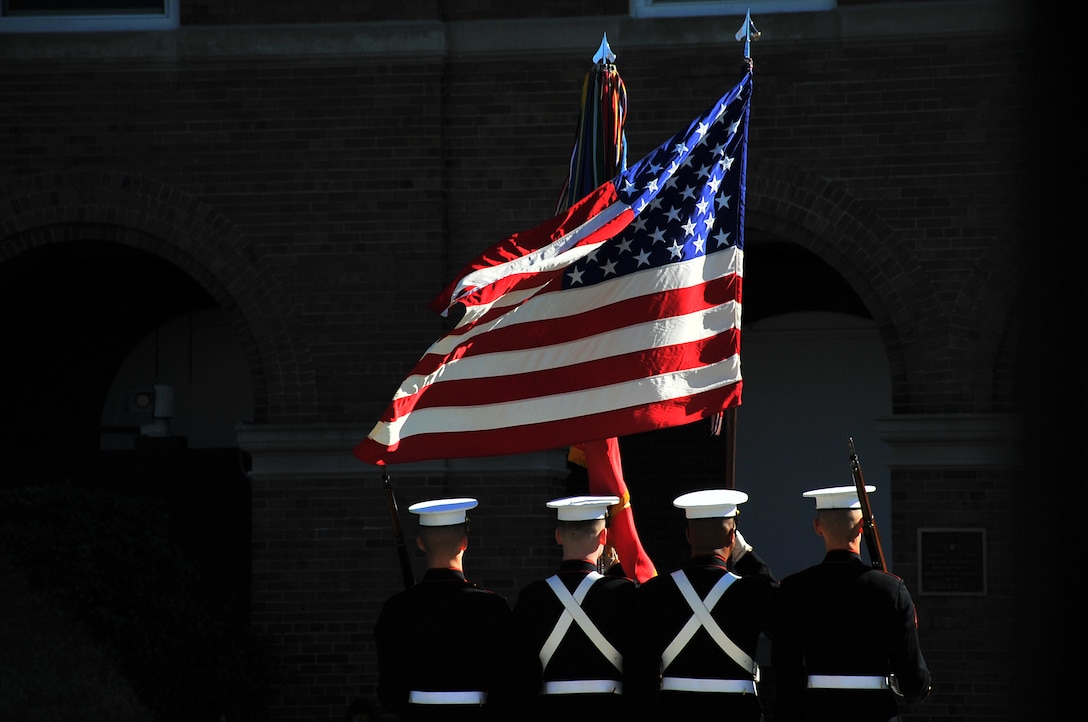 The Marine Corps Color Guard posts the colors during the passage of command ceremony at Marine Barracks Washington, D.C., Oct. 17. Gen. Joseph Dunford relieved Gen. James Amos to become the Commandant of the Marine Corps during the ceremony. (U.S. Coast Guard photo by Petty Officer 2nd Class Patrick Kelley)