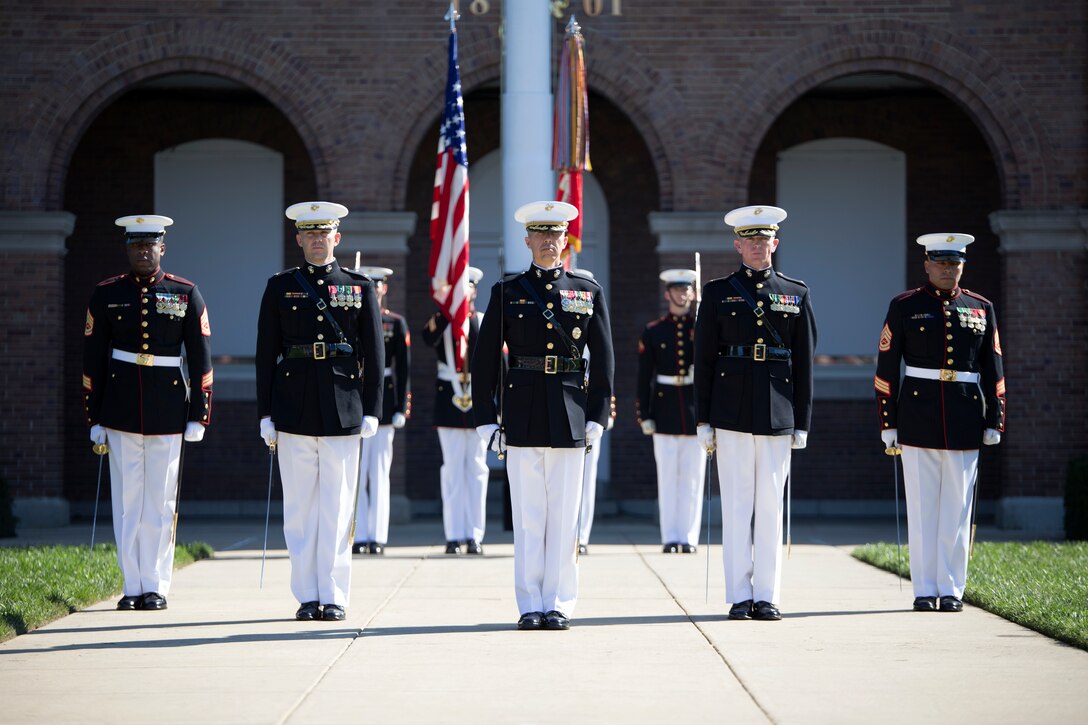 The parade staff stand ready to welcome the new commandant, General Joseph Dunford, before an audience of service members during the commandant passage of command ceremony at Marine Barracks Washington, D.C., Oct. 17. After 44 years of honorable service to the Corps, Gen. James Amos passed the torch to Gen. Joseph Dunford. (U.S. Marine Corps photo by Cpl. Clayton Filipowicz/Released)