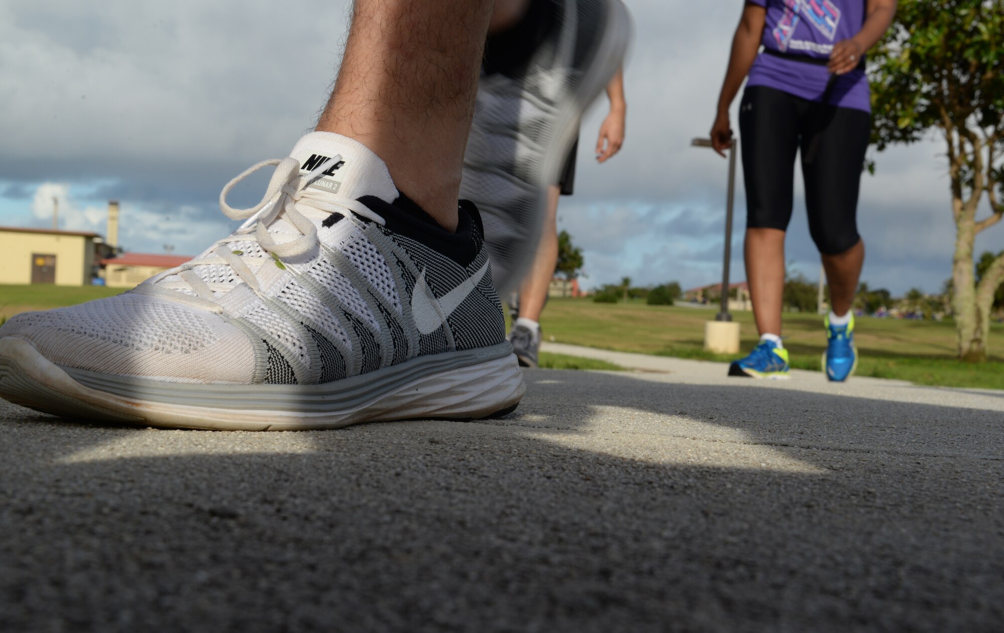 Members finish an Awareness Walk in support of Domestic Violence Awareness and Prevention month Oct. 16, 2014, on Andersen Air Force Base, Guam. The walk was one of three events hosted by the program and focused on the “Safe” aspect of the theme, “Relationships Should be Safe, Respectful and Positive”. (U.S. Air Force photo by Airman 1st Class Amanda Morris/Released)