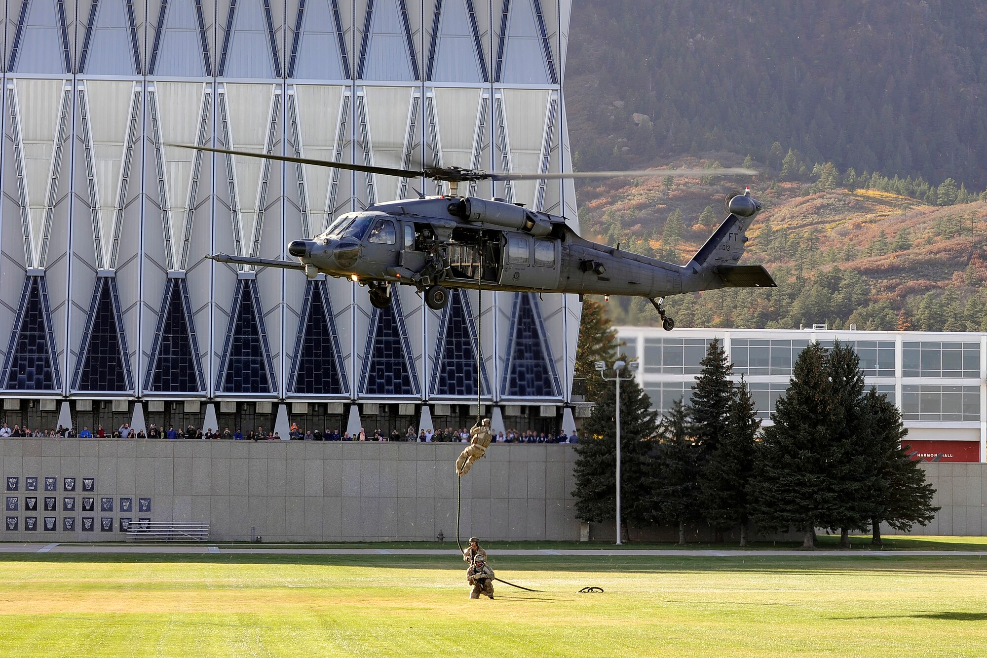 Pararescuemen from the 58th Rescue Squadron at Nellis Air Force Base, Nev.,
fast-rope from a hovering HH60 Pavehawk helicopter as it hovers over the
cadet area Oct. 17, 2014. The pararescuemen and combat rescue officers from the
23rd Wing, Moody Air Force Base, Ga., performed a Combat Search and Rescue
demonstration here to expose the Cadet Wing to the Air Force combat rescue
mission. (U.S. Air Force photo/Bill Evans)