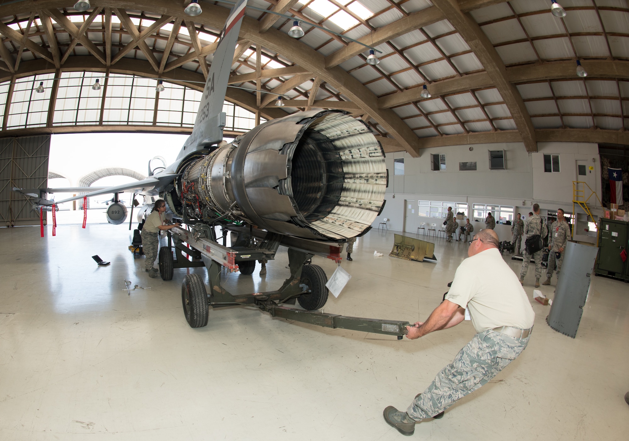 Engine mechanics from the 149th Maintenance Squadron, Texas Air National Guard perform an engine change on an F-16 Fighting Falcon during Salitre 2014, Oct. 12, at Cerro Moreno Air Force Base, near Antofagasta, Chile. Salitre is a Chilean-led exercise where the U.S., Chile, Brazil, Argentina and Uruguay, focus on increasing interoperability between allied nations. (Air National Guard photo by Senior Master Sgt. Elizabeth Gilbert/released)