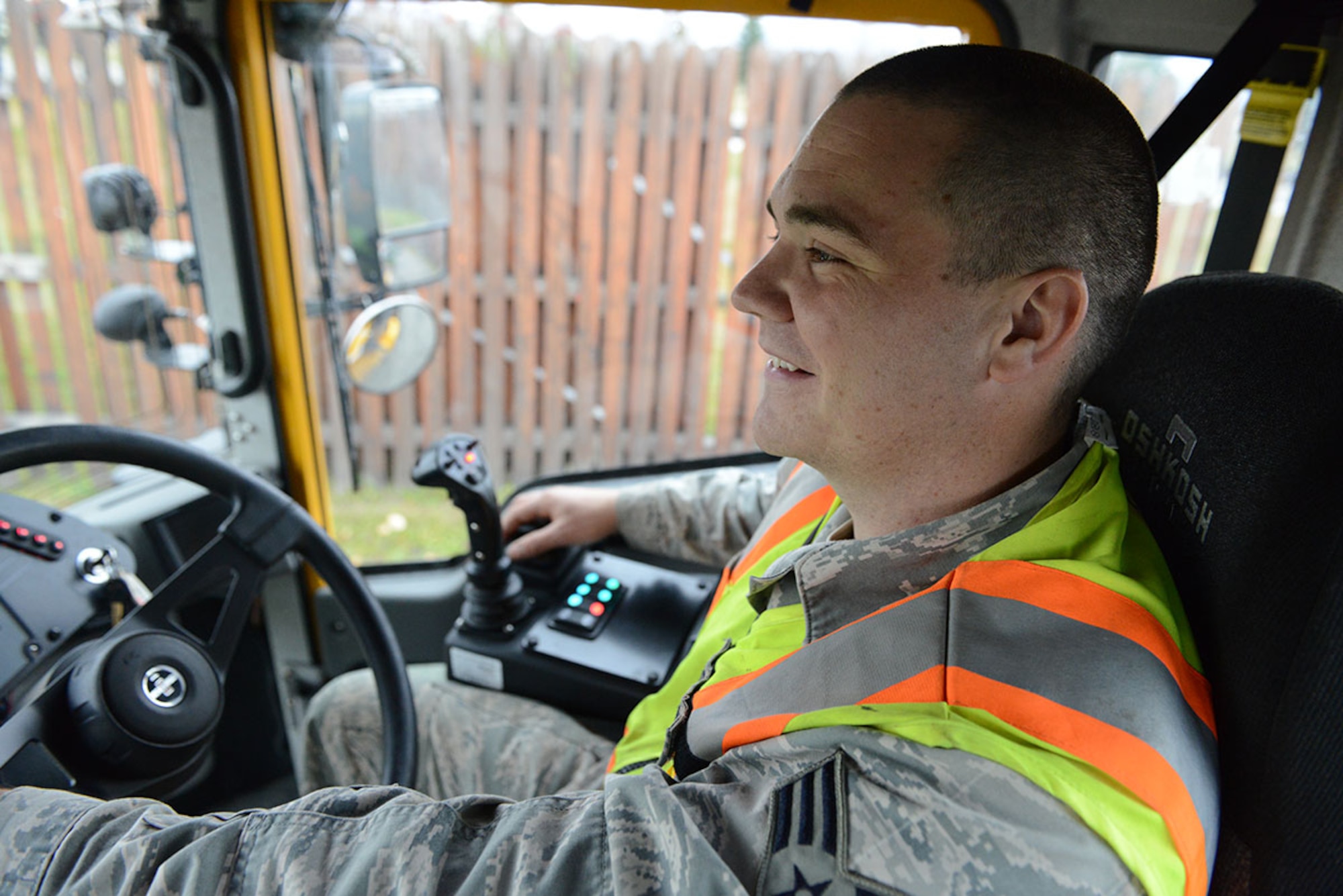 Senior Airman Alex Herschbach, 773d Civil Engineer Squadron, drives Rollover Snow Plow #71 in the JBER Snow Parade, October 10. (U.S. Air Force photo/Airman 1st Class Kyle Johnson)
