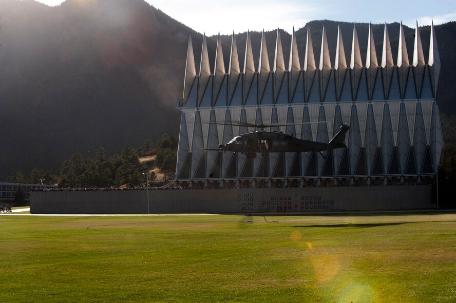 An HH-60G Pave Hawk lands during a Combat Search and Rescue Task Force demonstration Oct. 17, 2014, at the U.S. Air Force Academy in Colorado Springs, Colo. Soon after landing, 38th Rescue Squadron pararescuemen and combat rescue officers rescued simulated wounded service members. (U.S. Air Force photo by Airman 1st Class Dillian Bamman/Released)