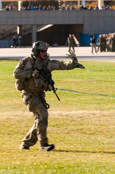 U.S. Air Force Maj. David Goodale, 38th Rescue Squadron combat rescue officer, helps rescue simulated wounded service members during a Combat Search and Rescue Task Force demonstration Oct. 17, 2014, at the U.S. Air Force Academy (USAFA) in Colorado Springs, Colo. The demonstration concluded the 23d Wing’s visit to its sponsored cadet, the Cadet Squadron 9 Vikings. (U.S. Air Force photo by Airman 1st Class Dillian Bamman/Released)
