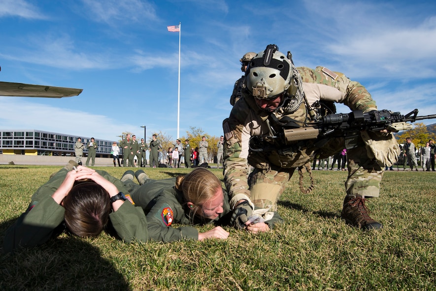 U.S. Air Force Maj. David Goodale, 38th Rescue Squadron combat rescue officer, rescues simulated wounded service members during a Combat Search and Rescue Task Force demonstration Oct. 17, 2014, at the U.S. Air Force Academy in Colorado Springs, Colo. Cadets from Cadet Squadron 9, Moody’s sponsored CS, participated in the demonstration and flew with Goodale on an HH-60G Pave Hawk. (U.S. Air Force photo by Airman 1st Class Dillian Bamman/Released)