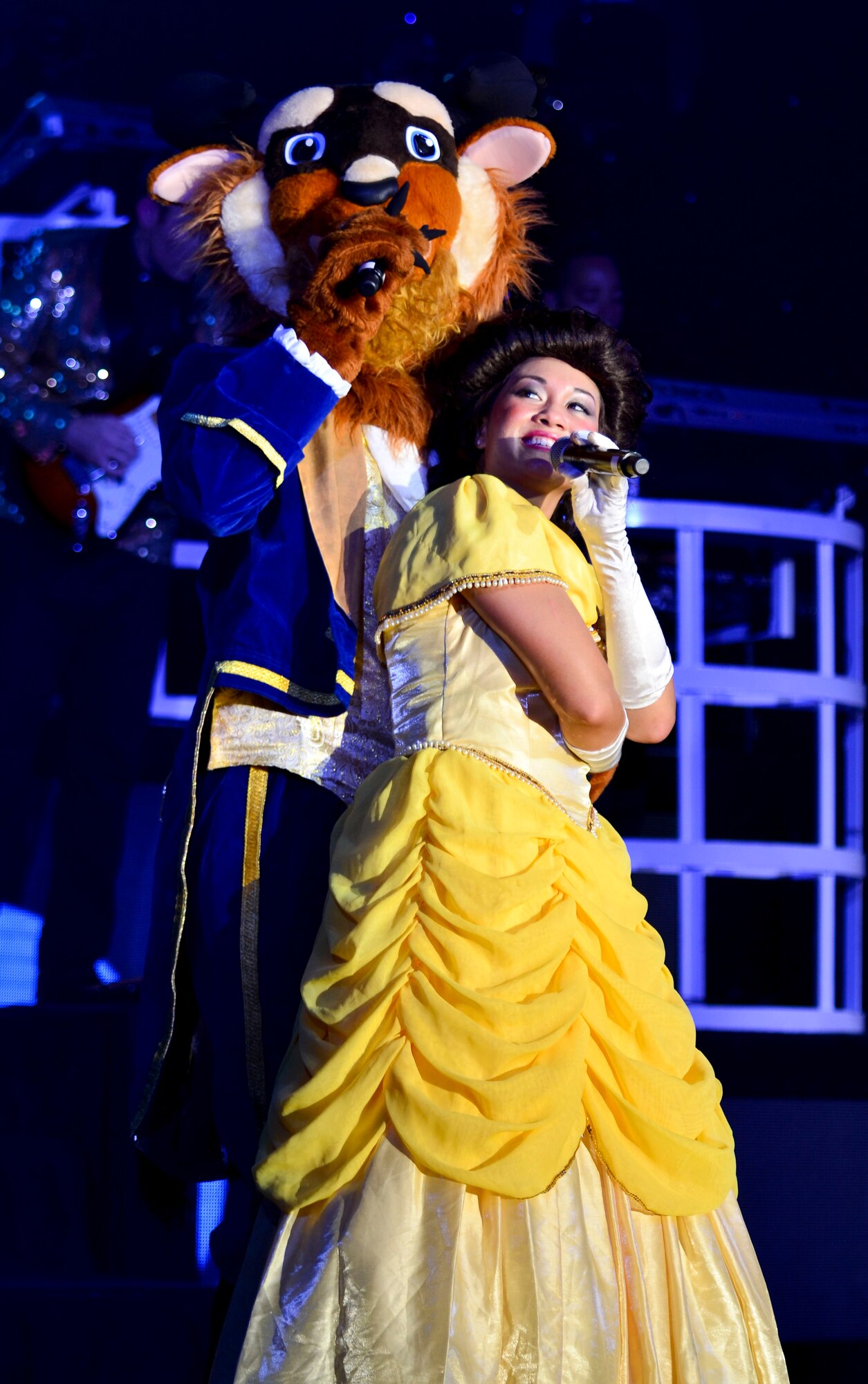 Staff Sgt. Gina Lavender, Tops in Blue vocalist, performs a song from Disney's "Beauty and the Beast" for the Barksdale community during the 2014 World Tour on Barksdale Air Force Base, La., Oct. 16, 2014. Their tour features music from Whitney Houston, the Doobie Brothers, Michael Jackson and patriotic music to name a few. (U.S. Air Force Photo/Airman 1st Class Mozer O. Da Cunha) 