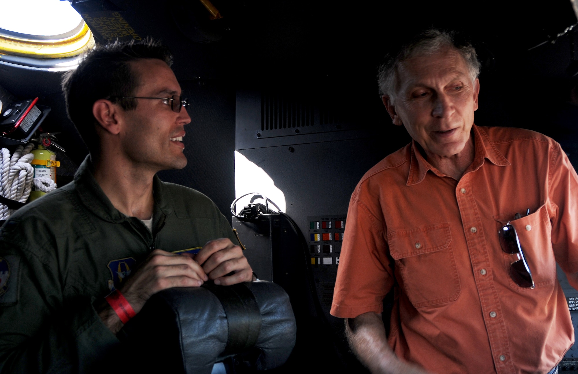 1st Lt. Anthony Toste, 700th Airlift Squadron C-130 pilot, and Brian Shuler, a Marietta, Ga. and former C-130 crew member, tell old war stories in the cockpit of a U.S. Air Force C-130 Hercules from Dobbins Air Reserve Base, Ga. Oct. 18, 2014, at the Wings over North Georgia air show in Rome, Ga. The static display was brought to WONG to help visitors better understand the capabilities of the 94th Airlift Wing. (U.S. Air Force photo by Senior Airman Daniel Phelps/Released)