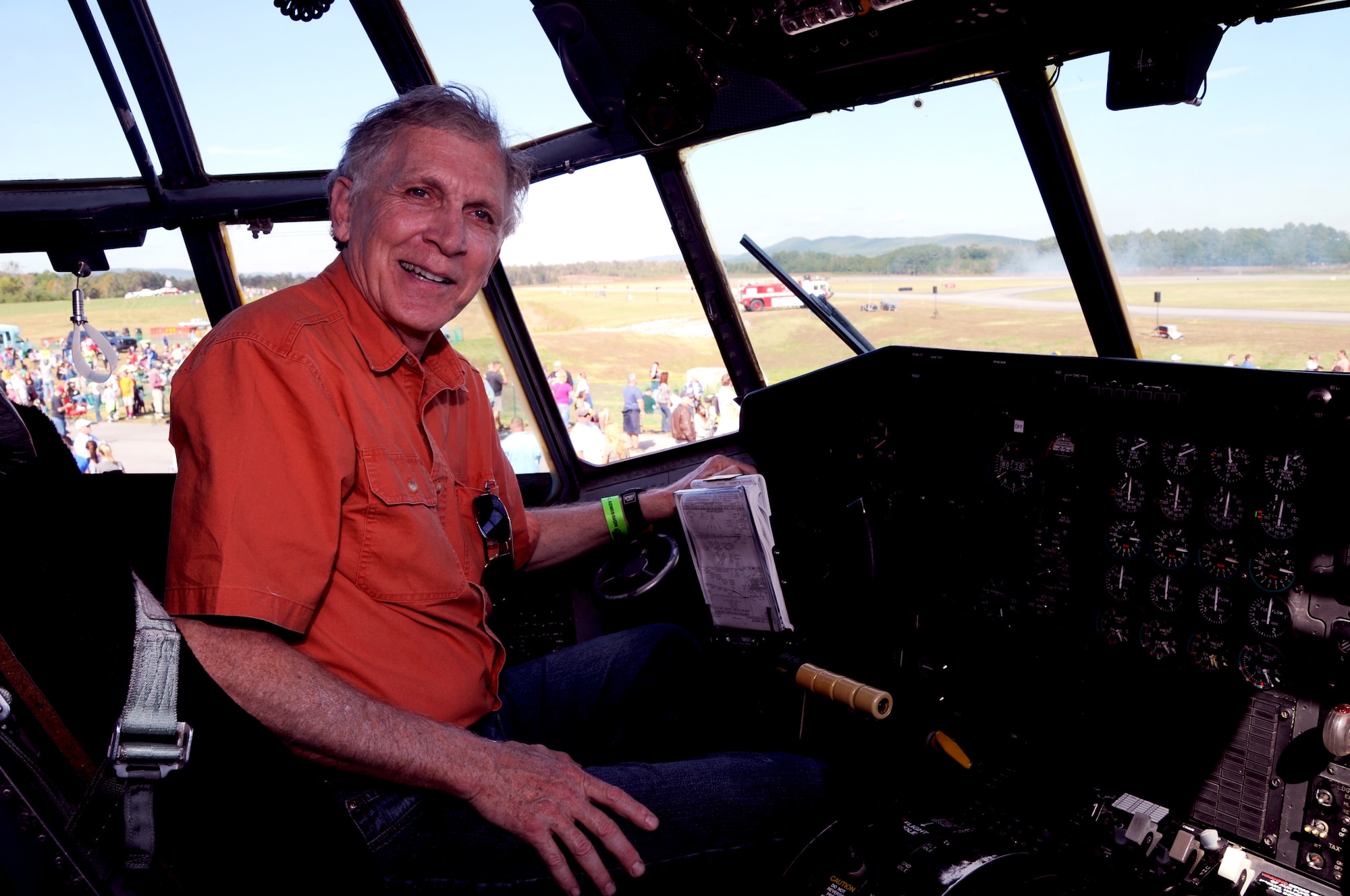 Brian Shuler, a Marietta, Ga. resident and former C-130 crew member, poses for a photo in the static U.S. Force C-130 Hercules from Dobbins Air Reserve Base at the Wings over North Georgia air show in Rome, Ga, Oct. 18, 2014. The 700th Airlift Squadron brought a U.S. Air Force C-130 Hercules to the WONG air show as a static display. (U.S. Air Force photo by Senior Airman Daniel Phelps/Released)