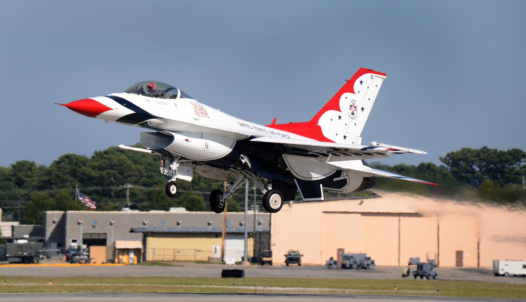 Thunderbird #6, Maj. Jason Curtis, flying opposing solo, departs Dobbins Air Reserve Base for the Wings Over North Georgia air show Oct. 18, 2014. The USAF Air Demonstration Squadron Thunderbirds are using Dobbins as their base of operations for their performances at the air show this weekend at the Russell Regional Airport in Rome, Georgia. (U.S. Air Force photo/ Brad Fallin/Released)