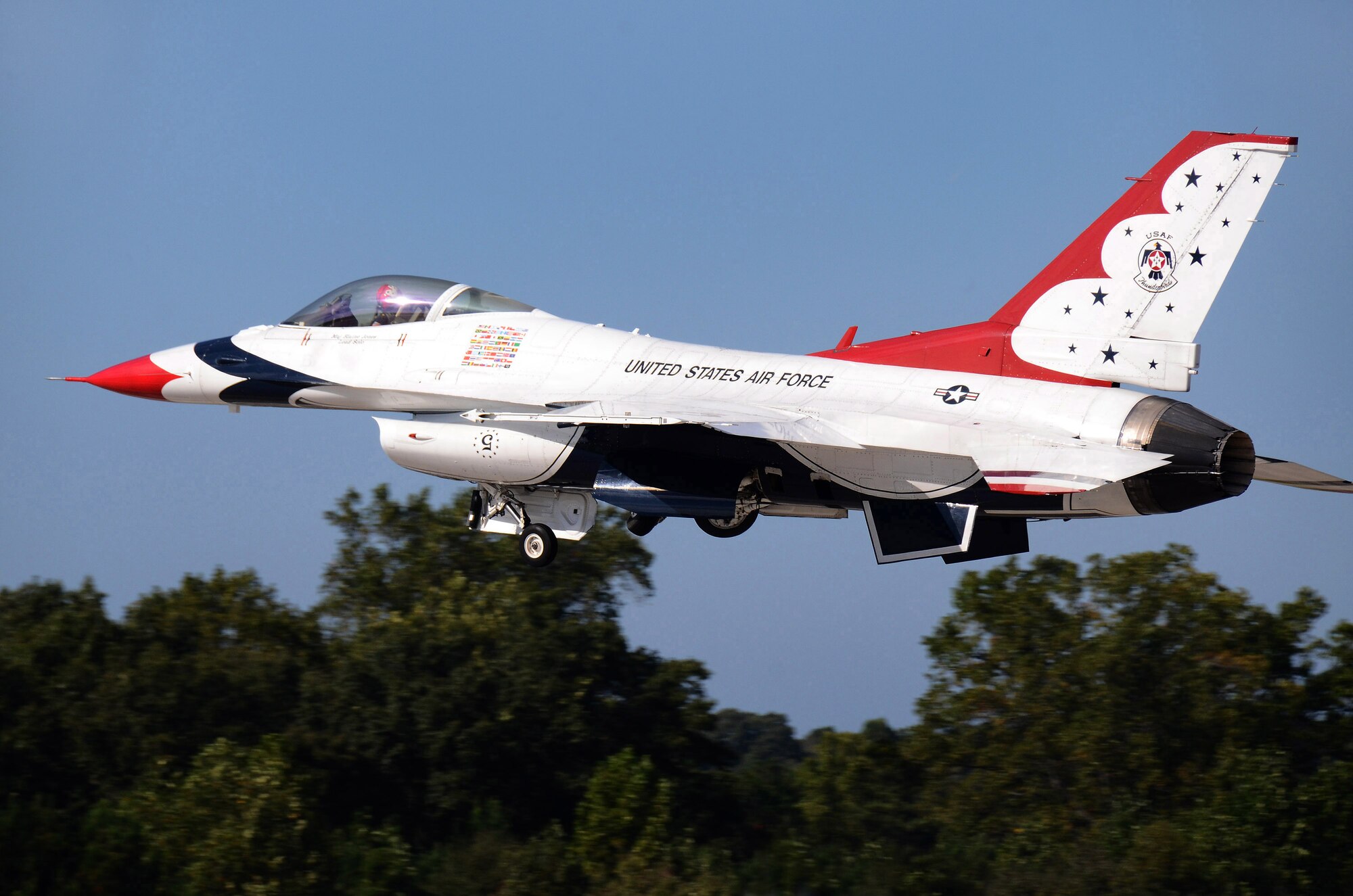 Thunderbird #5, Maj. Blaine Jones, flying lead solo, departs Dobbins Air Reserve Base for the Wings Over North Georgia air show Oct. 18, 2014. The USAF Air Demonstration Squadron Thunderbirds are using Dobbins as their base of operations for their performances at the air show this weekend at the Russell Regional Airport in Rome, Georgia. (U.S. Air Force photo/ Brad Fallin/Released)