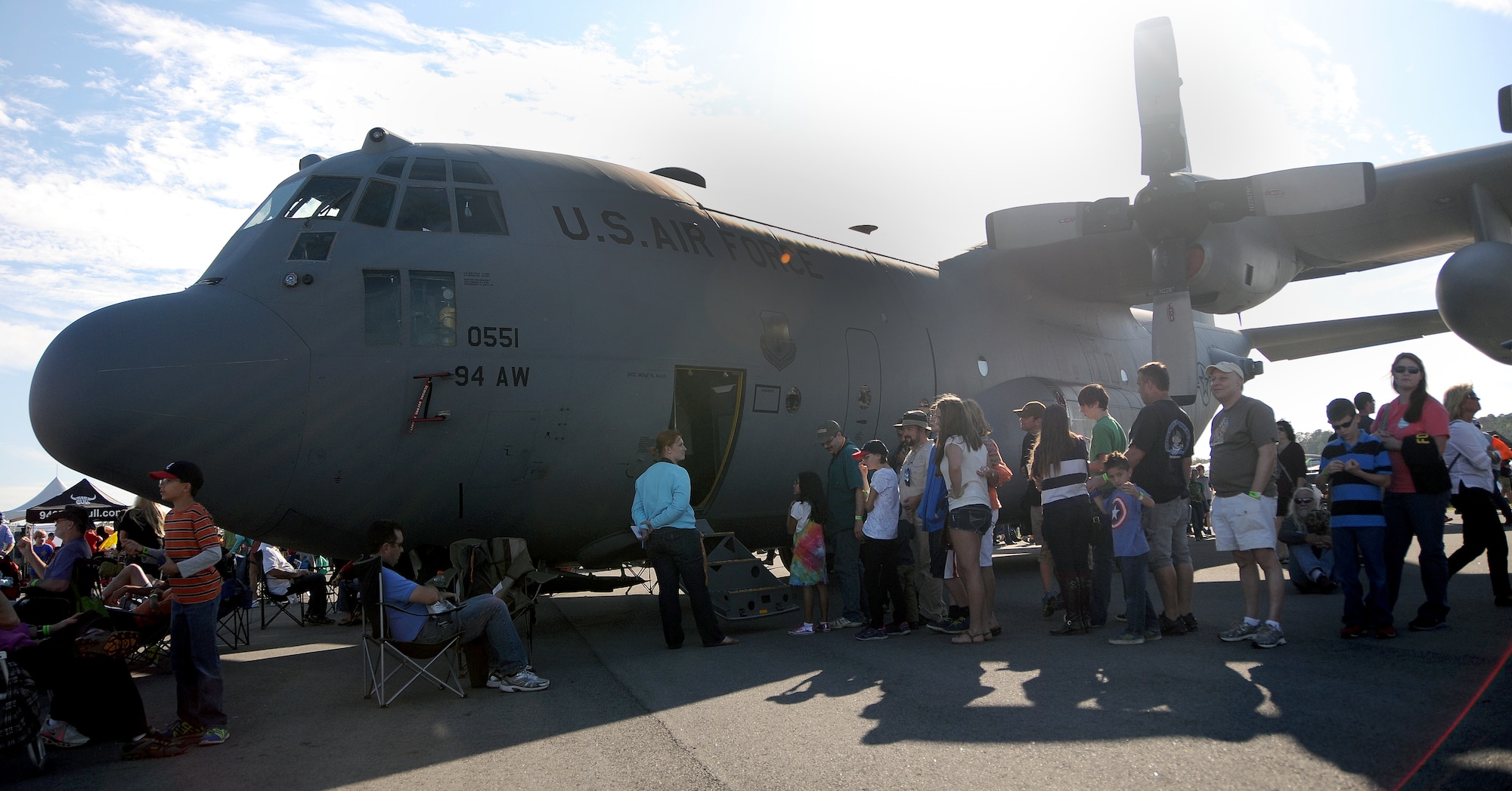 Visitors to the Wings over North Georgia air show line up to tour the cockpit of a U.S. Air Force C-130 Hercules from Dobbins Air Reserve Base, Ga. Oct. 18, 2014, at Rome, Ga. The static display was brought to WONG to help visitors better understand the capabilities of the 94th Airlift Wing. (U.S. Air Force photo by Senior Airman Daniel Phelps/Released)