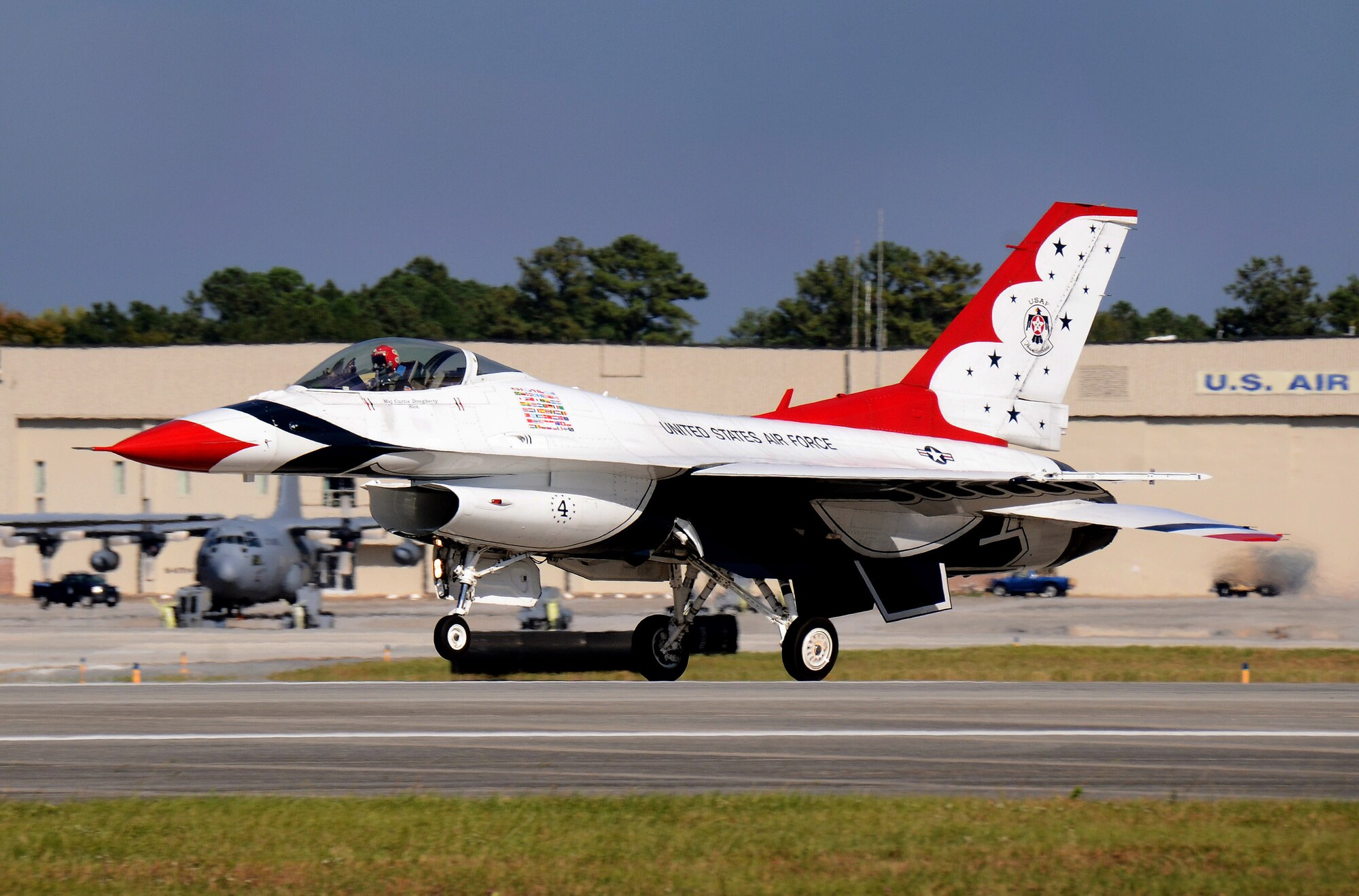 Thunderbird #4, Maj. Curtis Dougherty, flying the slot in the diamond formation, departs Dobbins Air Reserve Base for the Wings Over North Georgia air show Oct. 18, 2014. The USAF Air Demonstration Squadron Thunderbirds are using Dobbins as their base of operations for their performances at the air show this weekend at the Russell Regional Airport in Rome, Georgia. (U.S. Air Force photo/ Brad Fallin/Released)