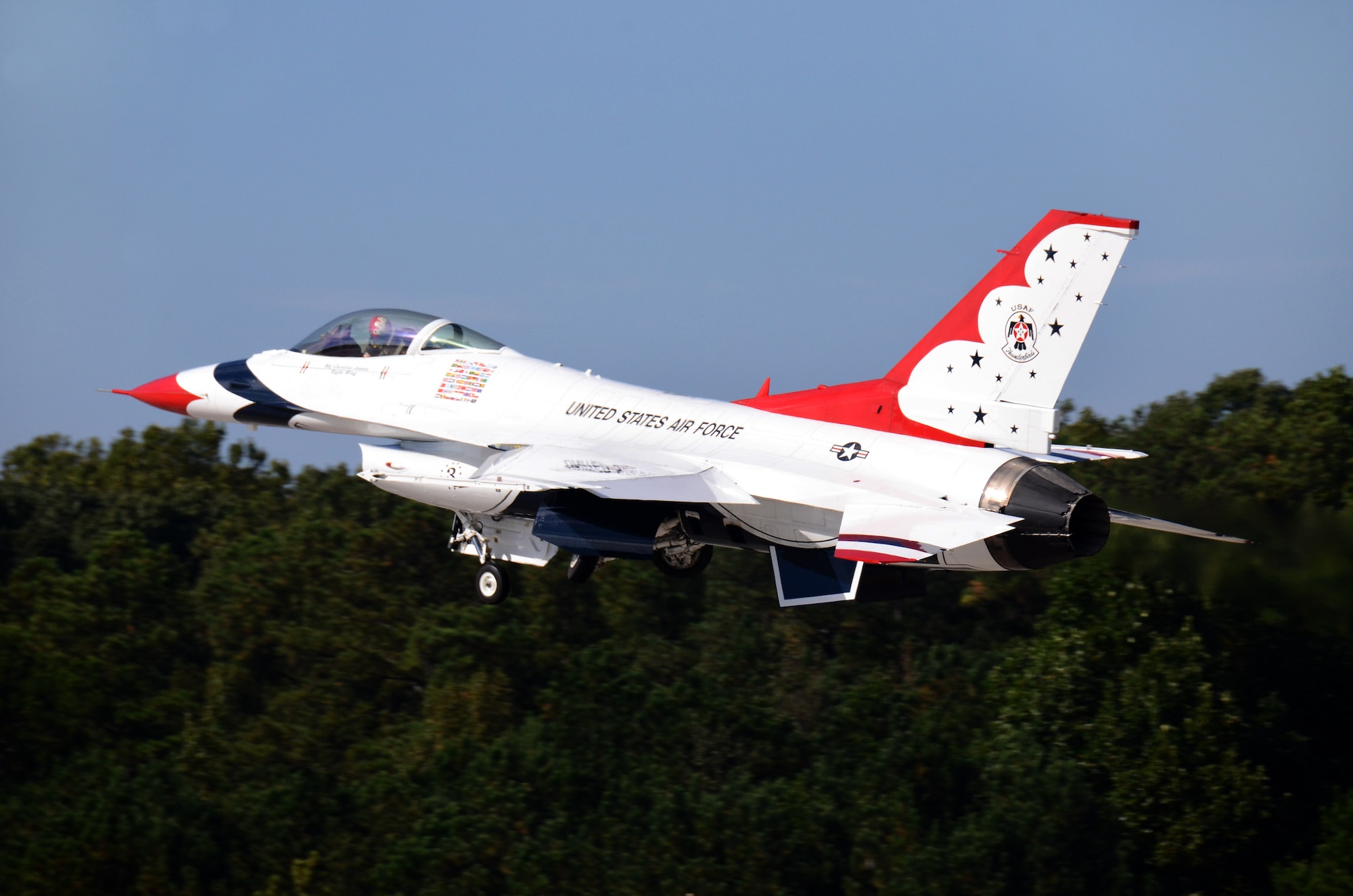 Thunderbird #3, Maj. Caroline Jensen, flying right wing in the diamond formation, departs Dobbins Air Reserve Base for the Wings Over North Georgia air show Oct. 18, 2014. The USAF Air Demonstration Squadron Thunderbirds are using Dobbins as their base of operations for their performances at the air show this weekend at the Russell Regional Airport in Rome, Georgia. (U.S. Air Force photo/ Brad Fallin/Released)