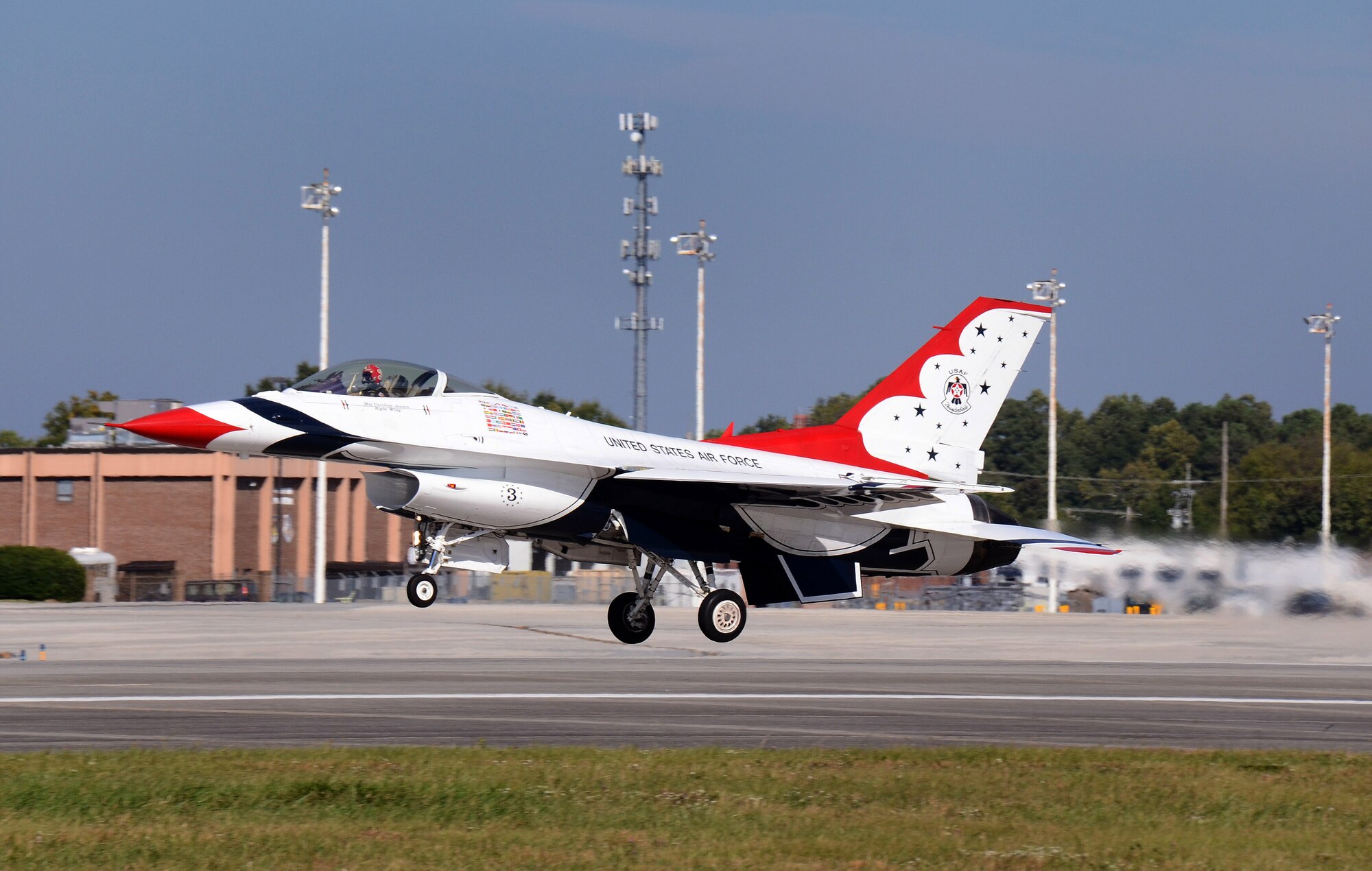 Thunderbird #3, Maj. Caroline Jensen, flying right wing in the diamond formation, departs Dobbins Air Reserve Base for the Wings Over North Georgia air show Oct. 18, 2014. The USAF Air Demonstration Squadron Thunderbirds are using Dobbins as their base of operations for their performances at the air show this weekend at the Russell Regional Airport in Rome, Georgia. (U.S. Air Force photo/ Brad Fallin/Released)