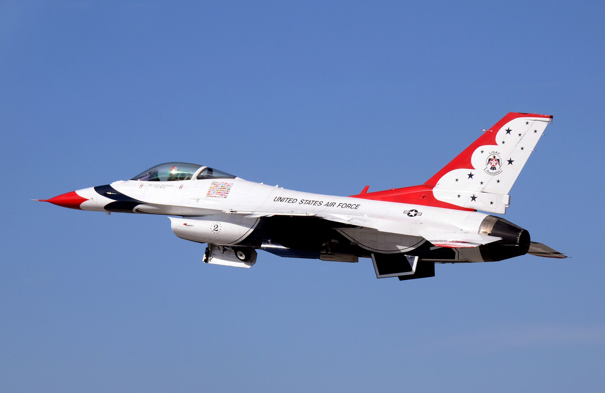 Thunderbird #2, Maj. Joshua Boudreaux, flying left wing in the diamond formation, departs Dobbins Air Reserve Base for the Wings Over North Georgia air show Oct. 18, 2014. The USAF Air Demonstration Squadron Thunderbirds are using Dobbins as their base of operations for their performances at the air show this weekend at the Russell Regional Airport in Rome, Georgia. (U.S. Air Force photo/ Brad Fallin/Released)