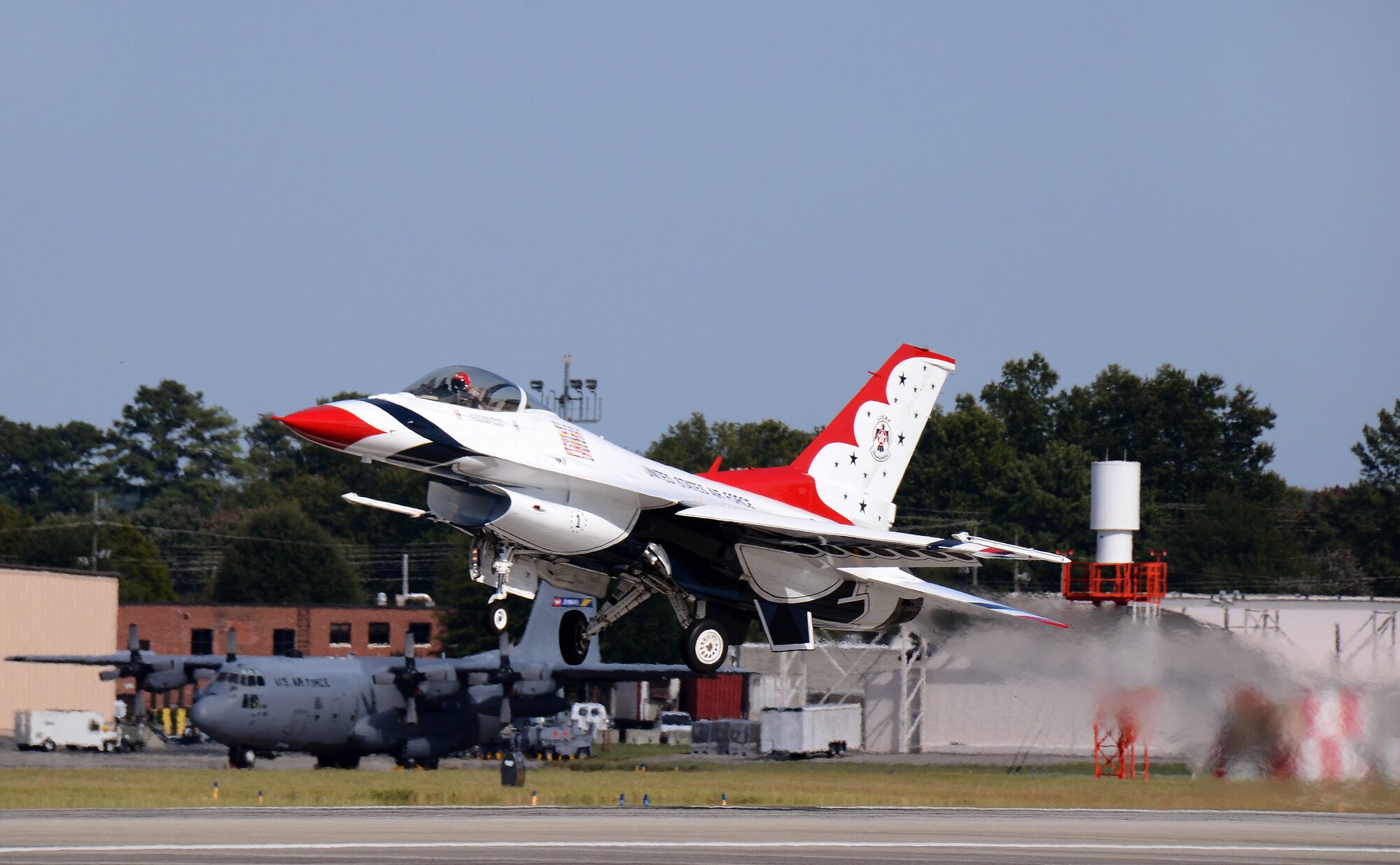 Thunderbird #1, Lt. Col. Greg Moseley, departs Dobbins Air Reserve Base for the Wings Over North Georgia air show Oct. 18, 2014. The USAF Air Demonstration Squadron Thunderbirds are using Dobbins as their base of operations for their performances at the air show this weekend at the Russell Regional Airport in Rome, Georgia. (U.S. Air Force photo/ Brad Fallin/Released)
