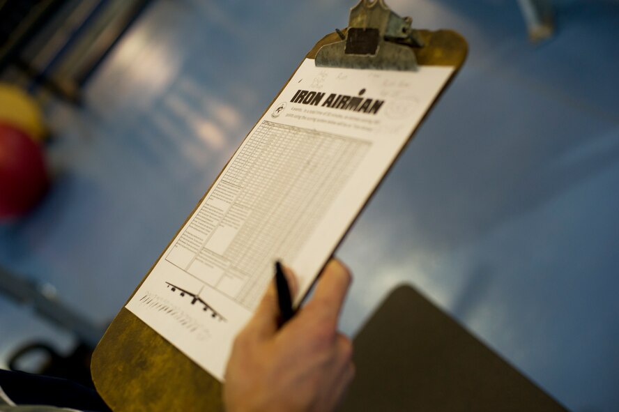 A physical training leader holds a clipboard on Minot Air Force Base, N.D., Oct. 10, 2014.  A PTL will monitor Airmen during the Iron Airman Challenge to ensure each event is completed properly within the correct amount of time and determine if the Airman is an Iron Airman. (U.S. Air Force photo/Airman 1st Class Sahara L. Fales)