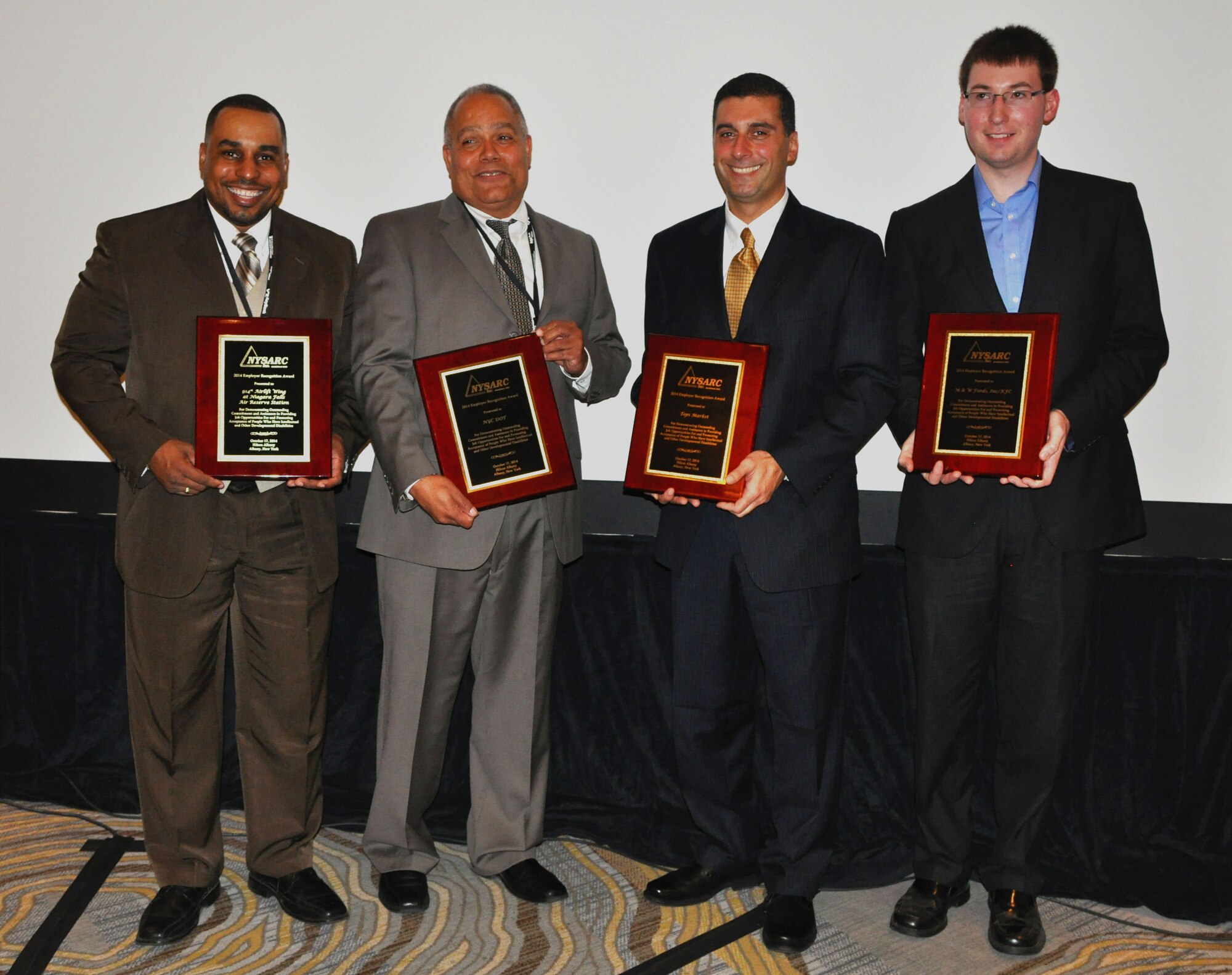 Murray Taylor (left), managing contract specialist for custodial services, 914th Airlift Wing, poses for a picture at Hilton Albany on Oct. 17, 2014. Taylor was there to accept the NYSARC Employers of the Year Award in recognition of the base's commitment and support in providing job opportunities for people who have intellectual or other developmental disabilities. (U.S. Air Force photo by Staff Sgt. Matthew Burke) 
