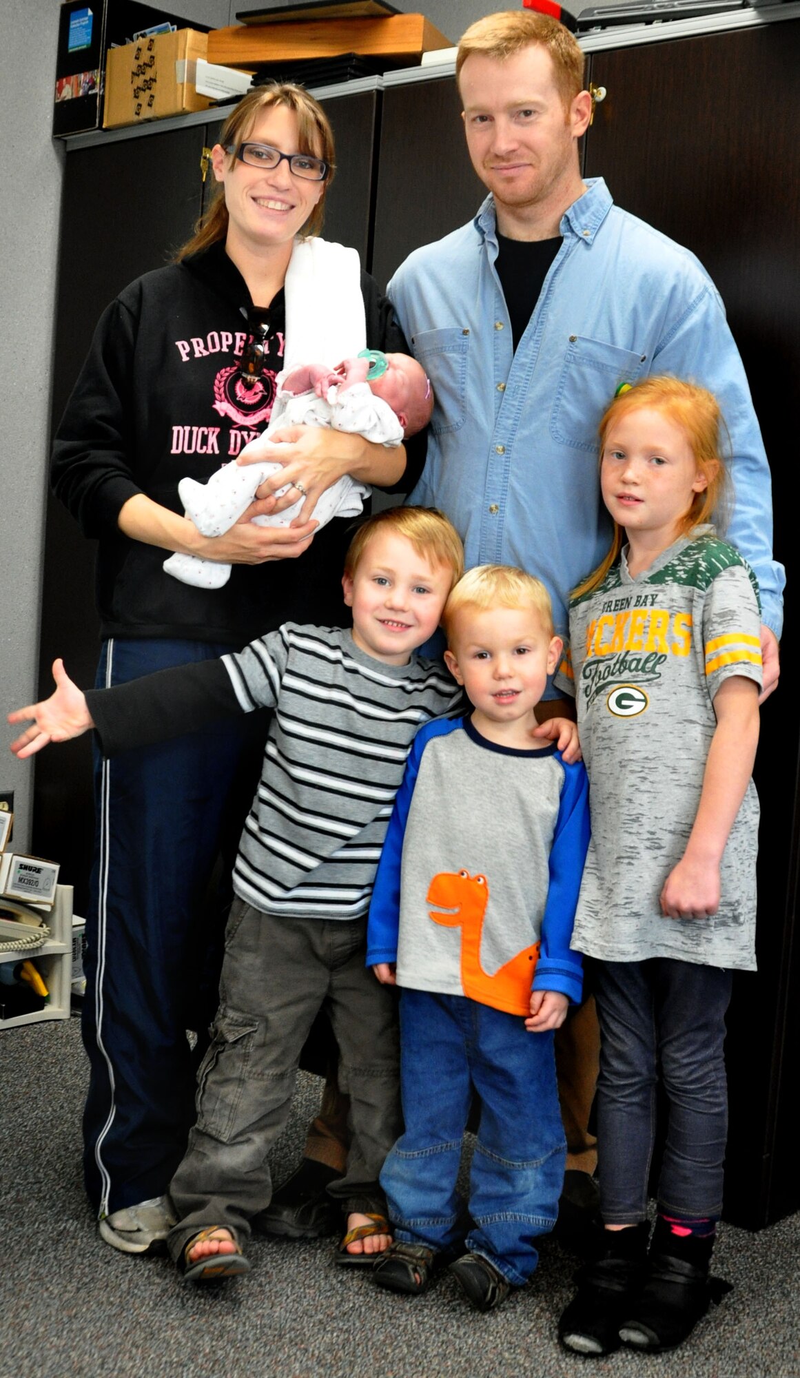Senior Master Sgt. Matthew Youkey and his wife Christina Youkey proudly show off their four children. Youkey is the first sergeant for the 442d Fighter Wing’s Force Support Squadron, but has been working at Air Force Reserve Command Headquarters at Robins AFB, Ga. since late June. He made it home four hours before the birth of his newest daughter, Addison Grace. (Air Force Photo by Tech. Sgt. Emily F. Alley)