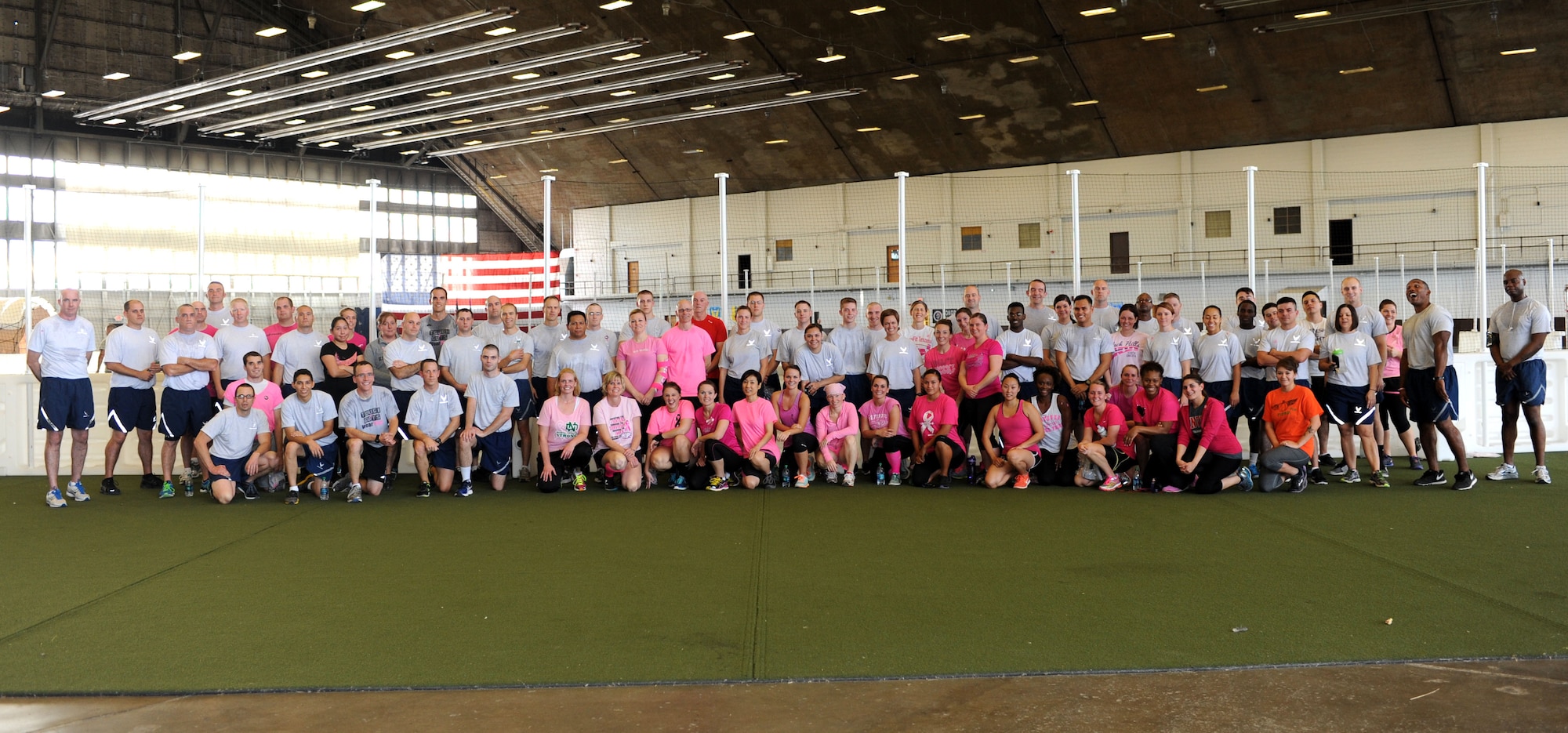 Airmen from the 28th Medical Group pose for a group photo after participating in the Breast Cancer Awareness Month walk-a-thon at the Pride Hangar at Ellsworth Air Force Base, S.D., Oct. 15, 2014. During the event, hosted by the base Health and Wellness Center, information was made available on upcoming medical screenings, breast care health, general wellness advice and other helpful recommendations from Dakota Radiology. (U.S. Air Force photo by Senior Airman Hailey R. Staker/Released)