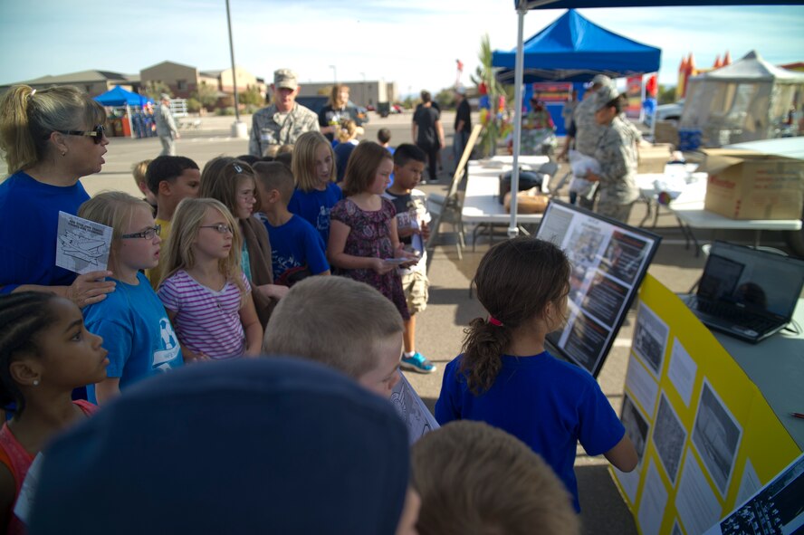 Children from the Holloman Elementary School visit booths during the Diversity Fair in the Base Exchange parking lot at Holloman Air Force Base, N.M., Oct. 17. Holloman kicked off it’s first-ever Diversity Fair, an event held for military members, their families, and downtown guests to educate them on various cultures and groups.  There was a variety of booths set up teaching members about the traditions and values of cultures from around the world. The event also had food, music and live demonstrations. “In 2011, President Obama created a mandate that every Department of Defense entity will hold a celebration that culminates all of the different diverse groups, which makes our military one of the best,” said Master Sgt. Robert Graves, 49th Wing Staff superintendent. (U.S. Air Force photo by Airman 1st Class Chase Cannon/Released)