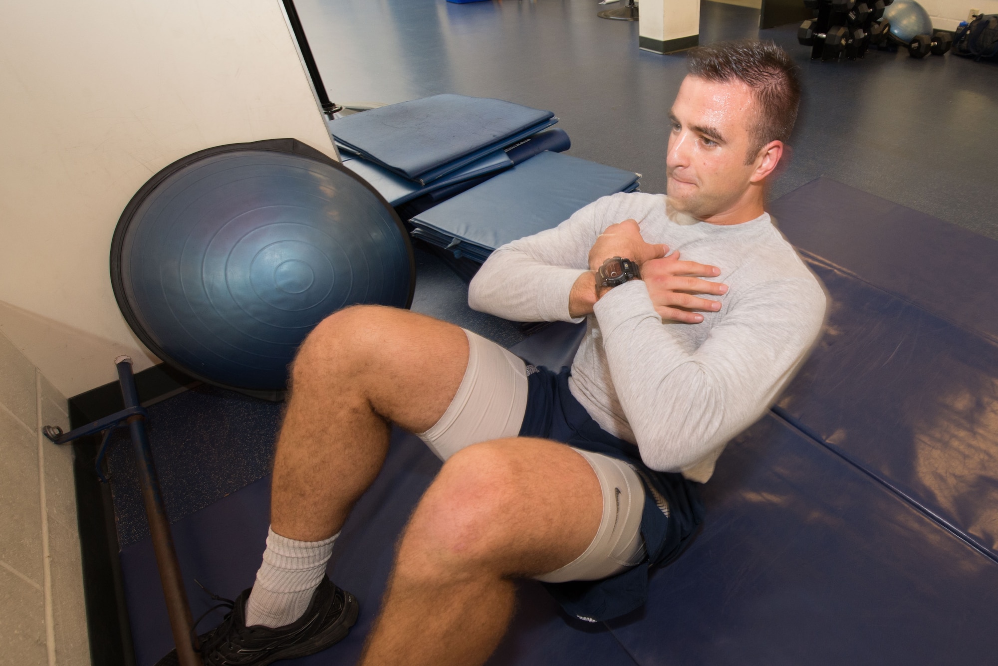 1st Lt. Jordan Waiwaiole practices the sit-up portion of the Air Force fitness assessment at the Hanscom Fitness Center Oct. 17. A new winter fitness assessment schedule begins Nov. 3. Assessments will take place Monday through Thursday at 10 a.m., 11 a.m., as well as noon, with six testing slots available per session. (U.S. Air Force photo by Mark Herlihy)