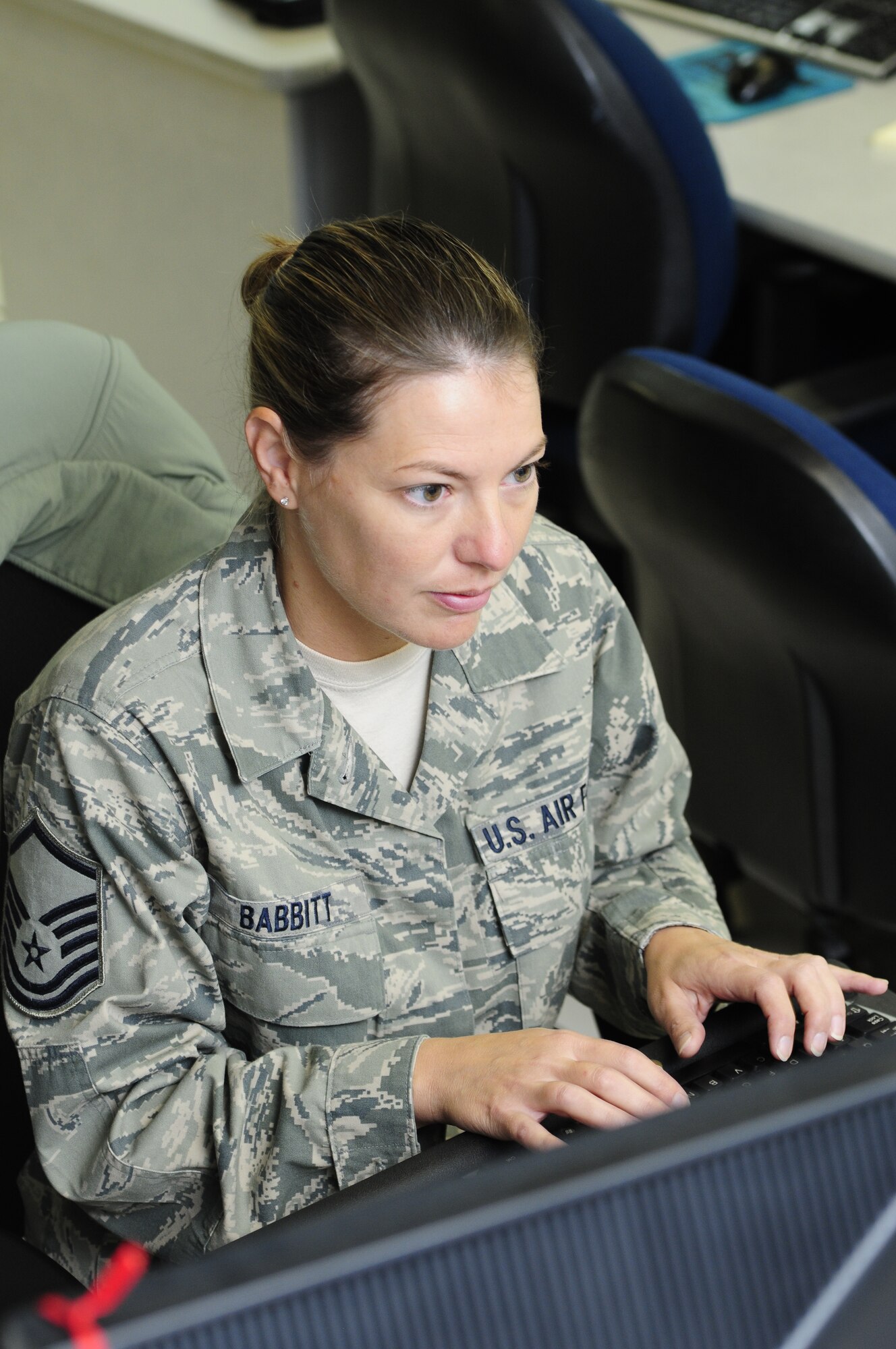U.S. Air Force Master Sgt. Tracy Babbitt, 145th Communications Flight, Information Assurance Manager, works from desktop PCs to top-secret server rooms, keeping critical tools up and running at the North Carolina Air National Guard base, Charlotte Douglas Intl. Airport, Oct. 1, 2014. Day to day, she ensures software and hardware are operating properly as well as troubleshoots and repair any issues users may have. (U.S. Air National Guard photo by Master Sgt. Patricia F. Moran, 145th Public Affairs/Released)