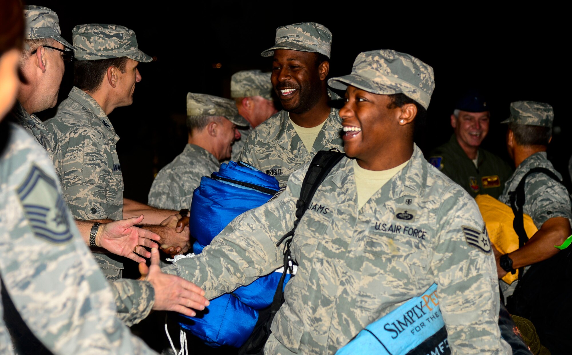 U.S. Air Force Airmen assigned to the 633rd Medical Group are greeted by leadership after returning from a deployment at Langley Air Force Base, Va., Oct. 20, 2014. The Airmen deployed to West Africa in support of the international community’s humanitarian relief operations in Ebola-stricken African nations. (U.S. Air Force photo by Senior Airman Kayla Newman/Released)