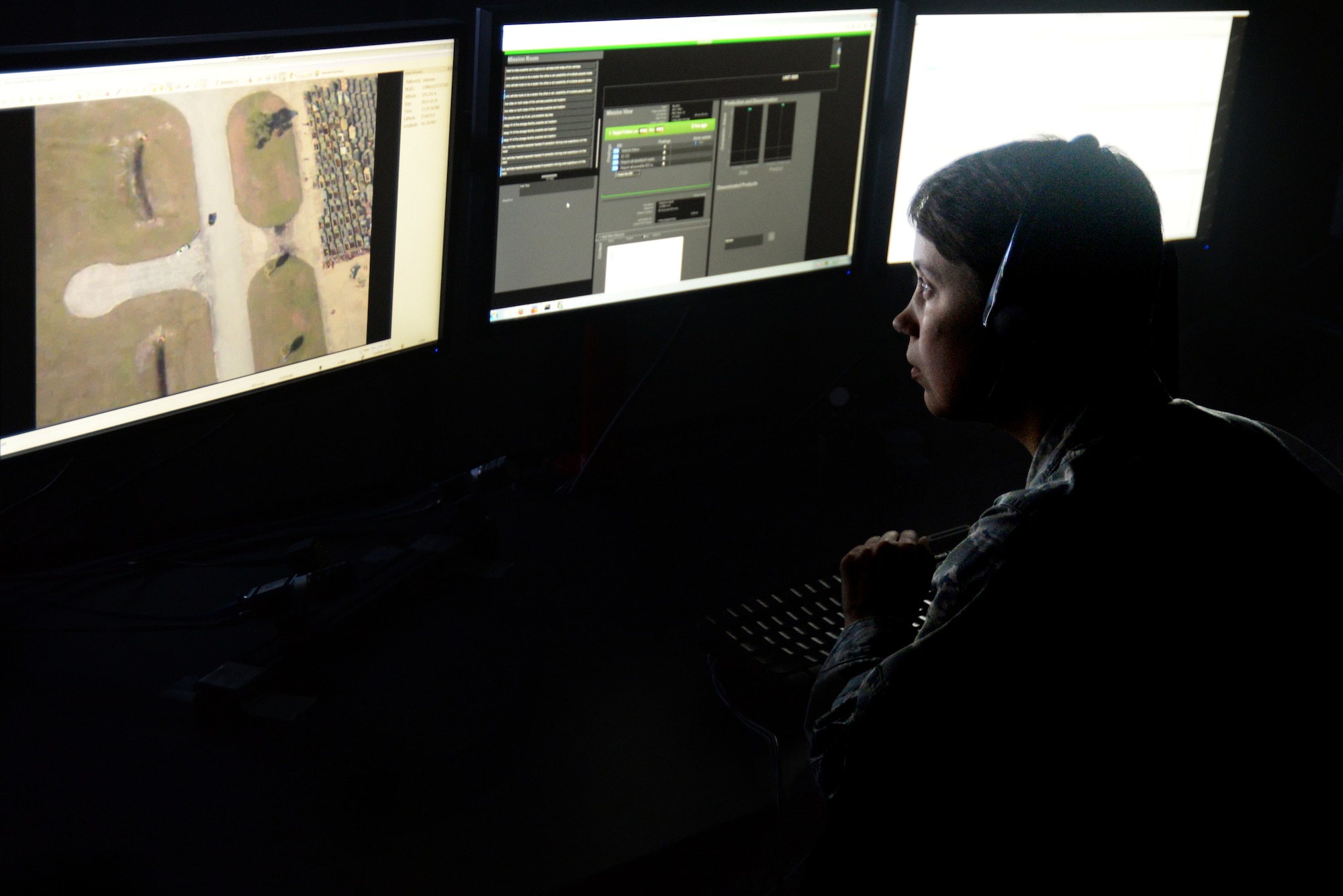 U.S. Air Force 1st Lt. Amanda Chichester, 711th Human Performance Wing behavioral scientist, watches a video loop for suspicious behavior during a demonstration of a new Enhanced Reporting, Narrative Event Streaming Tool developed by the Air Force Research Lab at Wright-Patterson Air Force Base, Ohio, Oct. 15, 2014.  The program streamlines some routine tasks performed by intelligence analysts in an effort to increase their overall effectiveness and productivity. (U.S. Air Force photo by Wesley Farnsworth)
