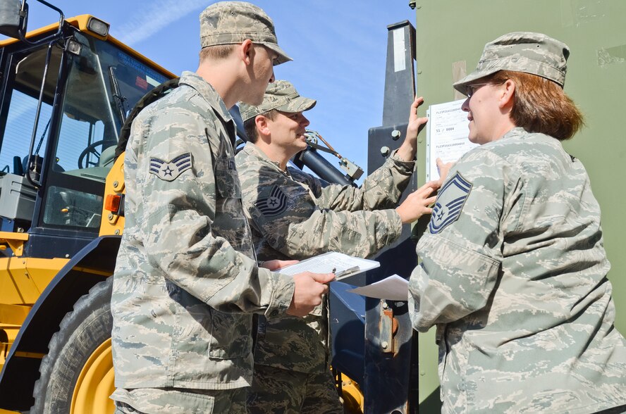 Airmen with the 116th Logistics Readiness Squadron Deployment Distribution Flight, Georgia Air National Guard, review a packing slip on an Internal Airlift/Helicopter Slingable-Container Unit during a Unit Training Assembly at Robins Air Force Base, Ga. Oct. 19, 2014.  These logistics planners are part of a six-member team that are responsible for implementing plans to move people, cargo and military assets downrange.  When personnel return home from deployment, the planners switch gears to the reintegration phase of their job, ensuring all members have the necessary resources for a successful transition. (U.S. Air National Guard photo by Senior Airman Kari Giles/Released)